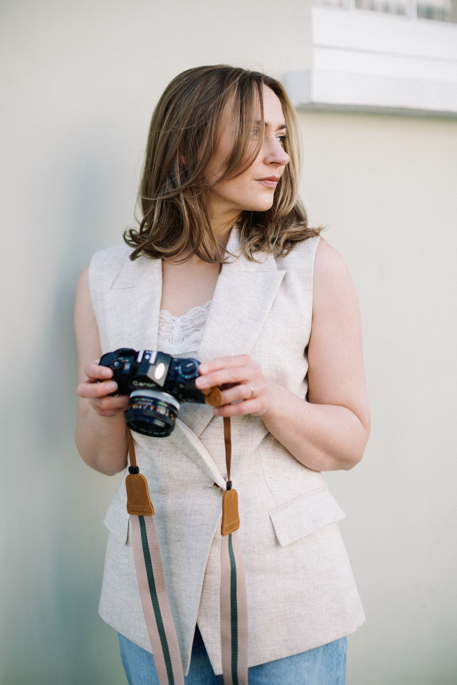 Miriam Caterina Wahl standing infront of a building in Notting Hill holding a film camera