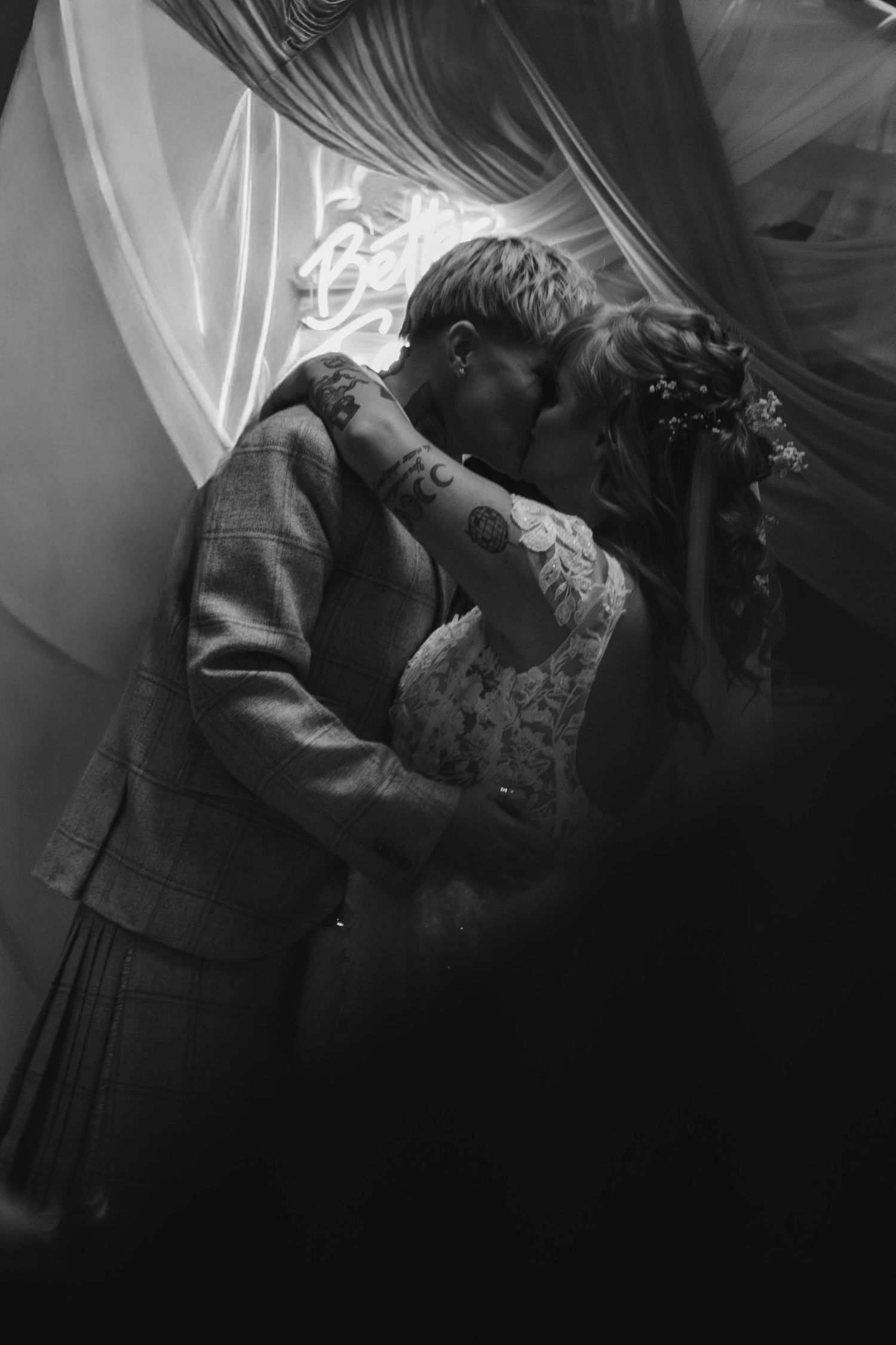 Intimate black and white wedding photos showing romantic moments between newlyweds.