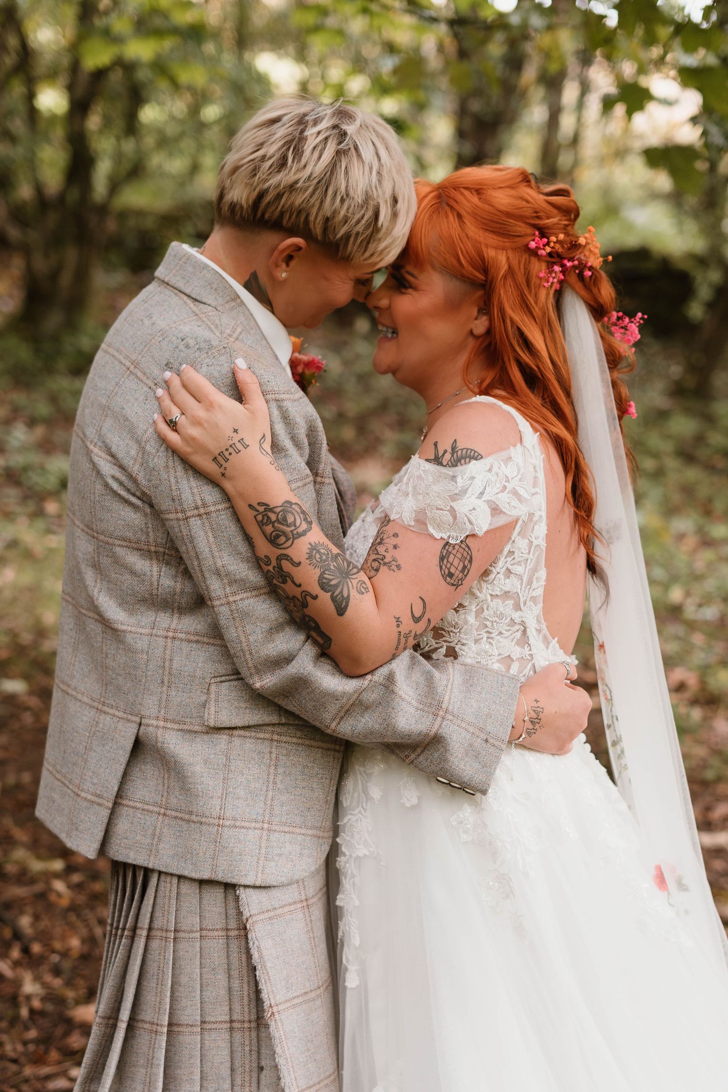 Romantic autumn wedding portraits showing couple embracing outdoors.