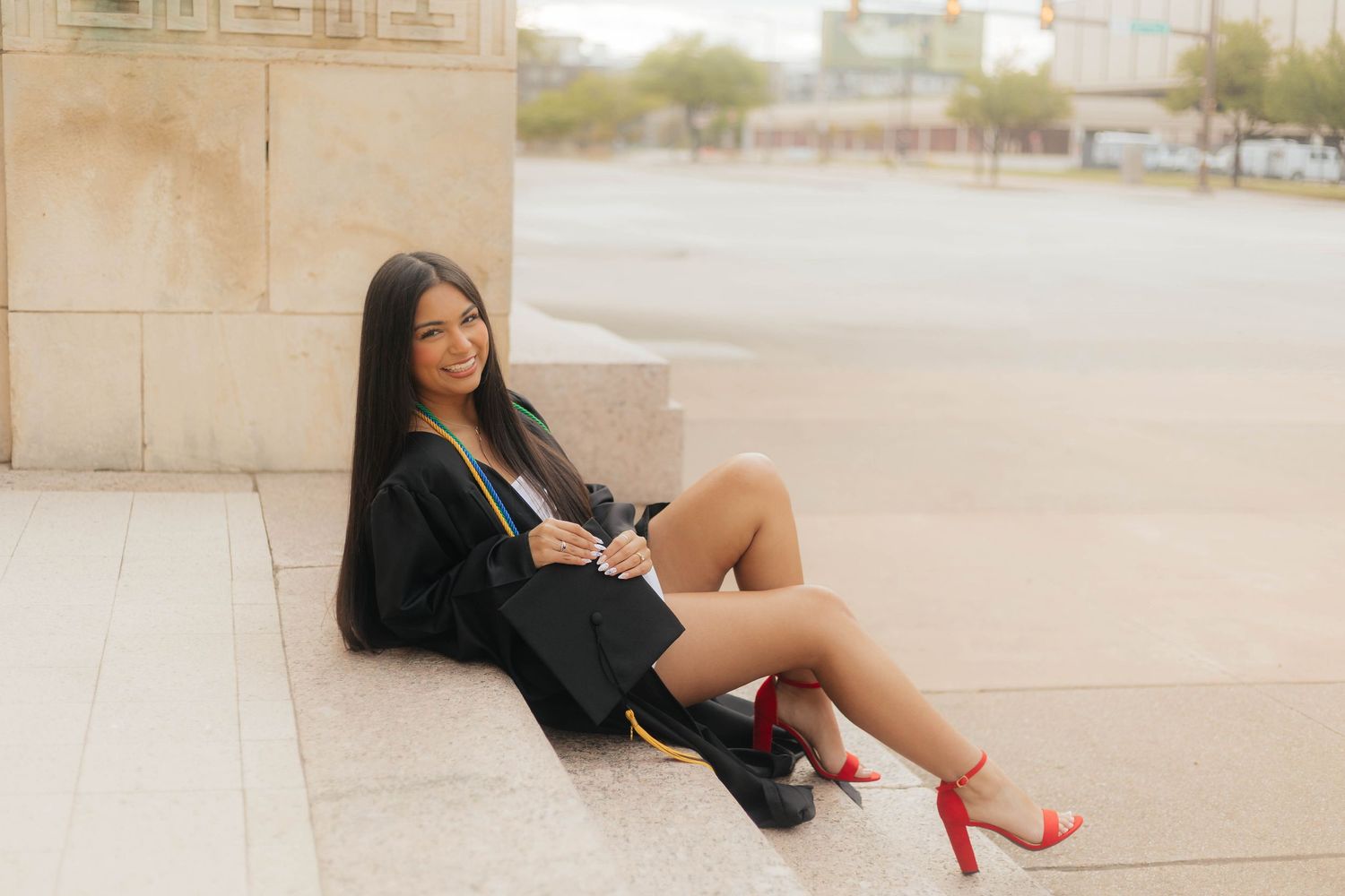 A series of fashion photos showing a black blazer outfit paired with red high heel sandals in an outdoor setting.