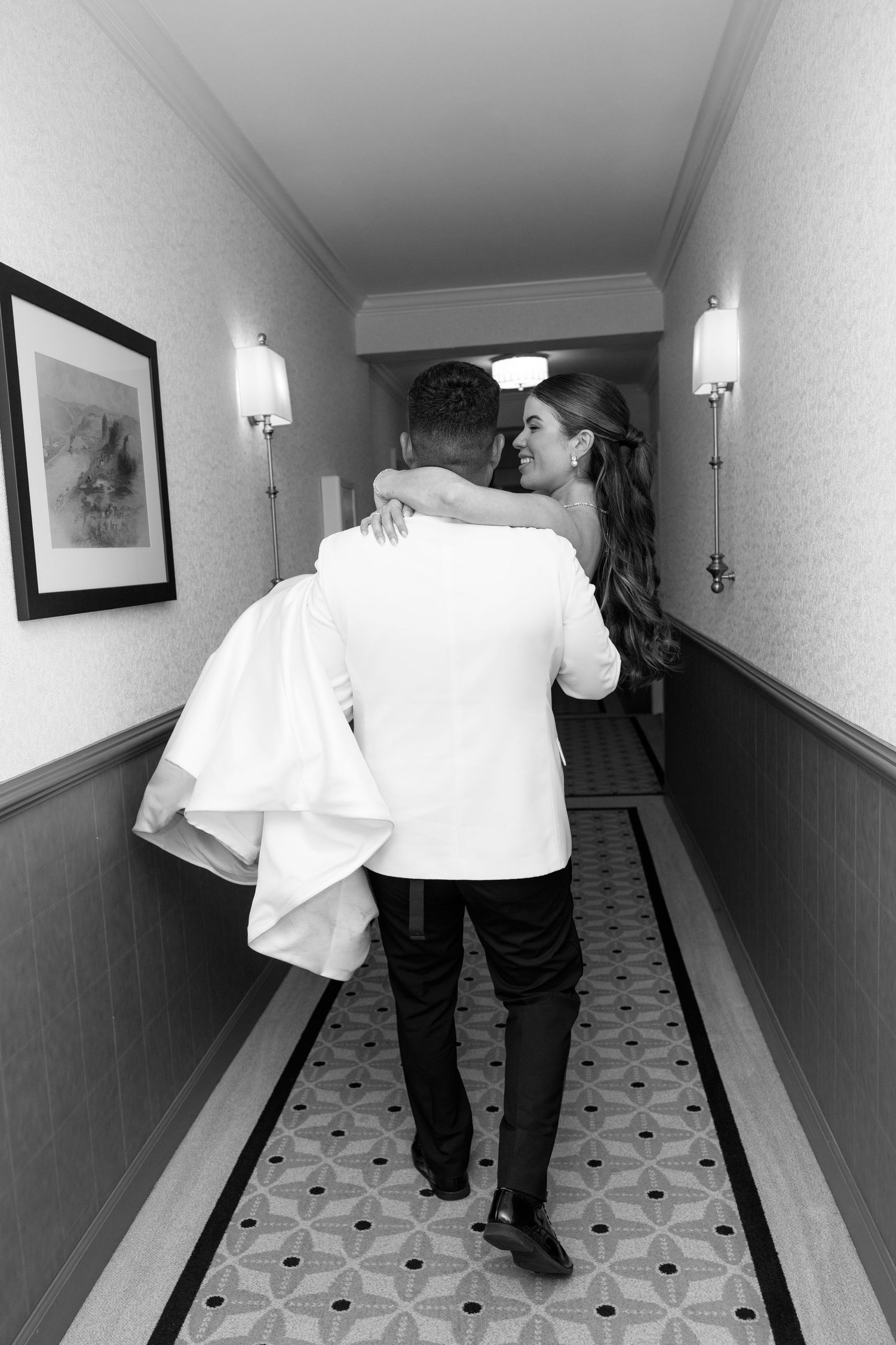 A series of black and white photos showing two people walking together down a hallway in formal attire.