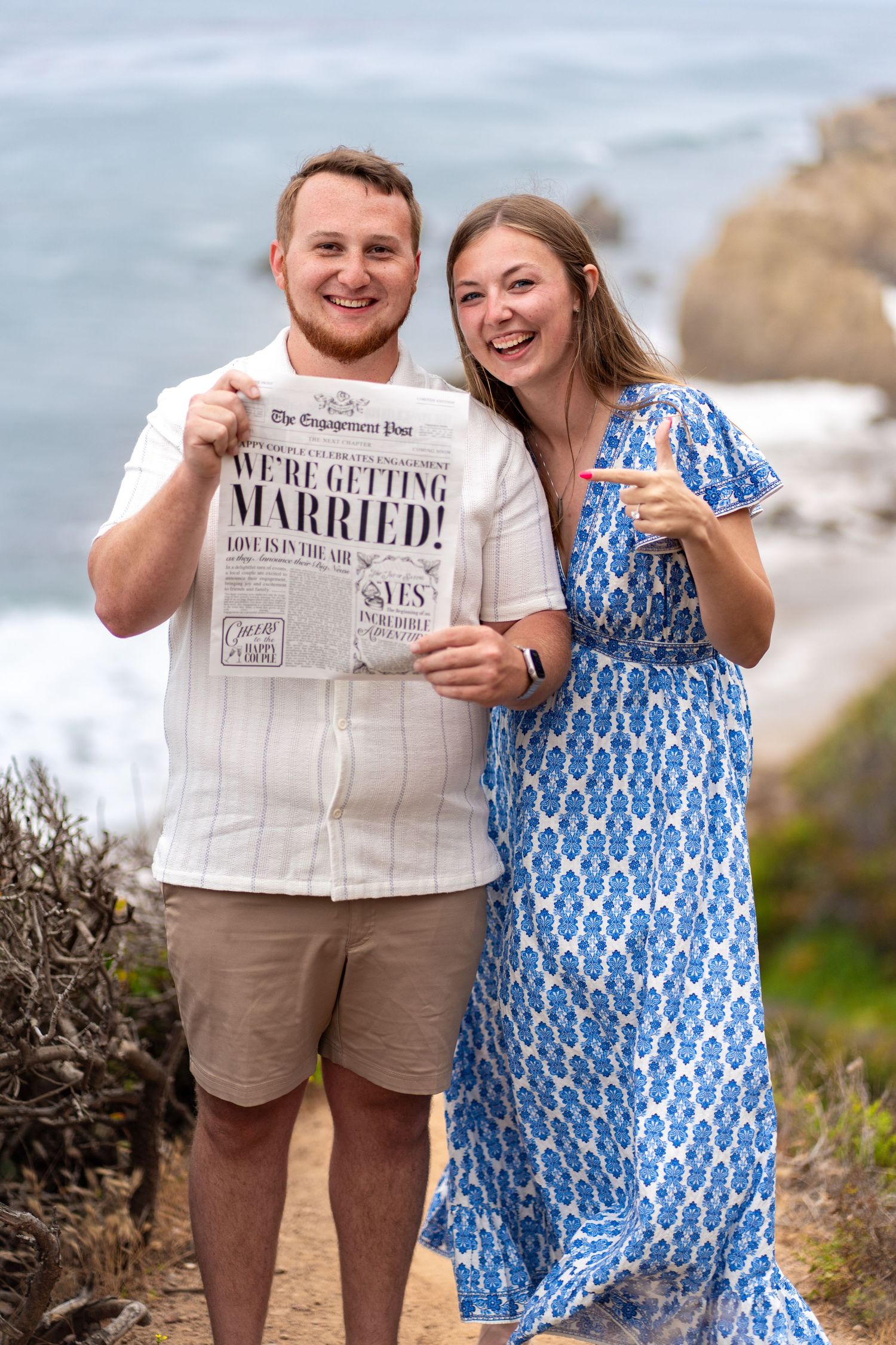 Engaged and making headlines! Posing with a custom engagement newspaper at El Matador. #EngagementNews #SheSaidYes