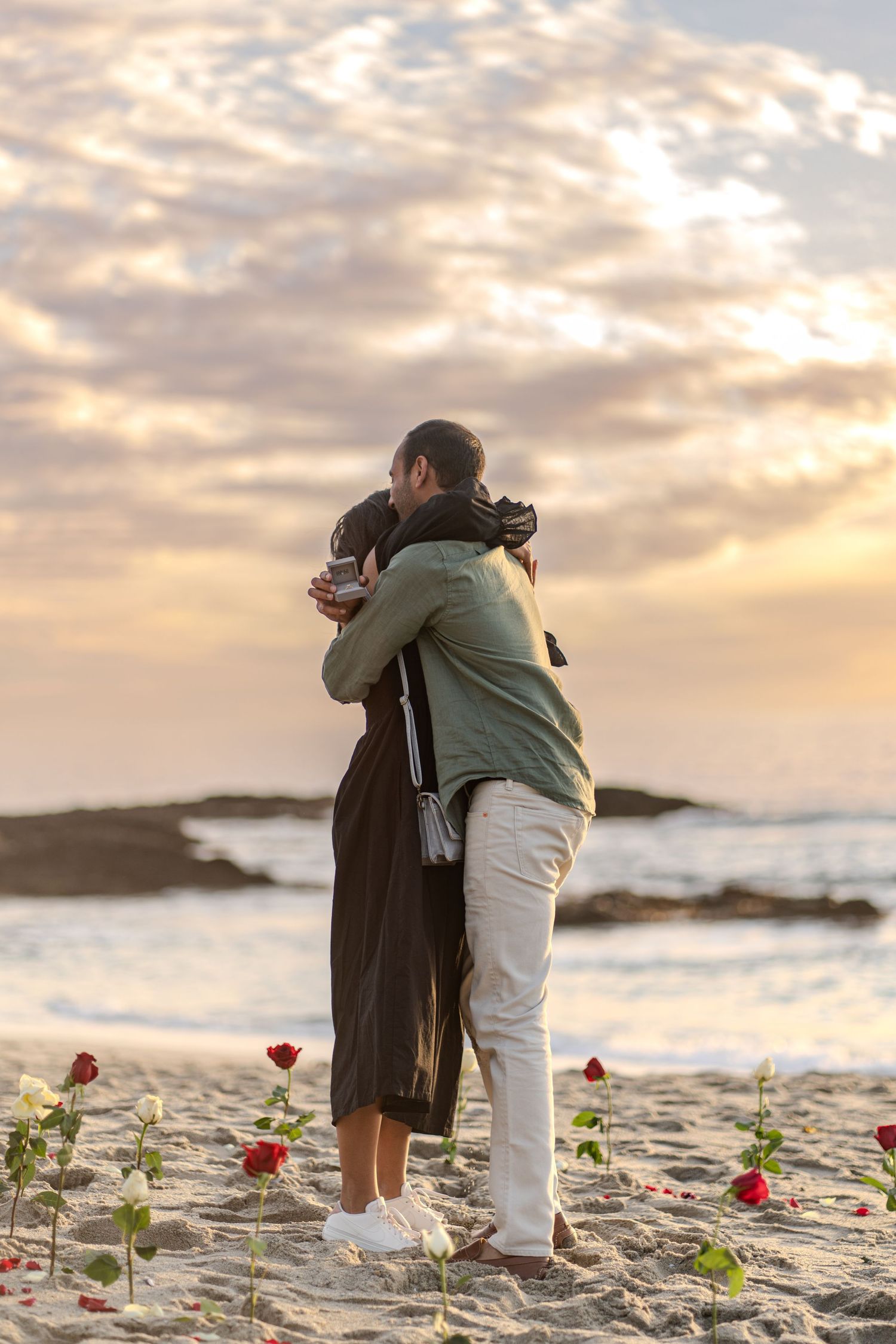 Newly engaged couple celebrating love with a stunning Laguna Beach backdrop, ocean views, and dreamy Southern California coastal scenery.