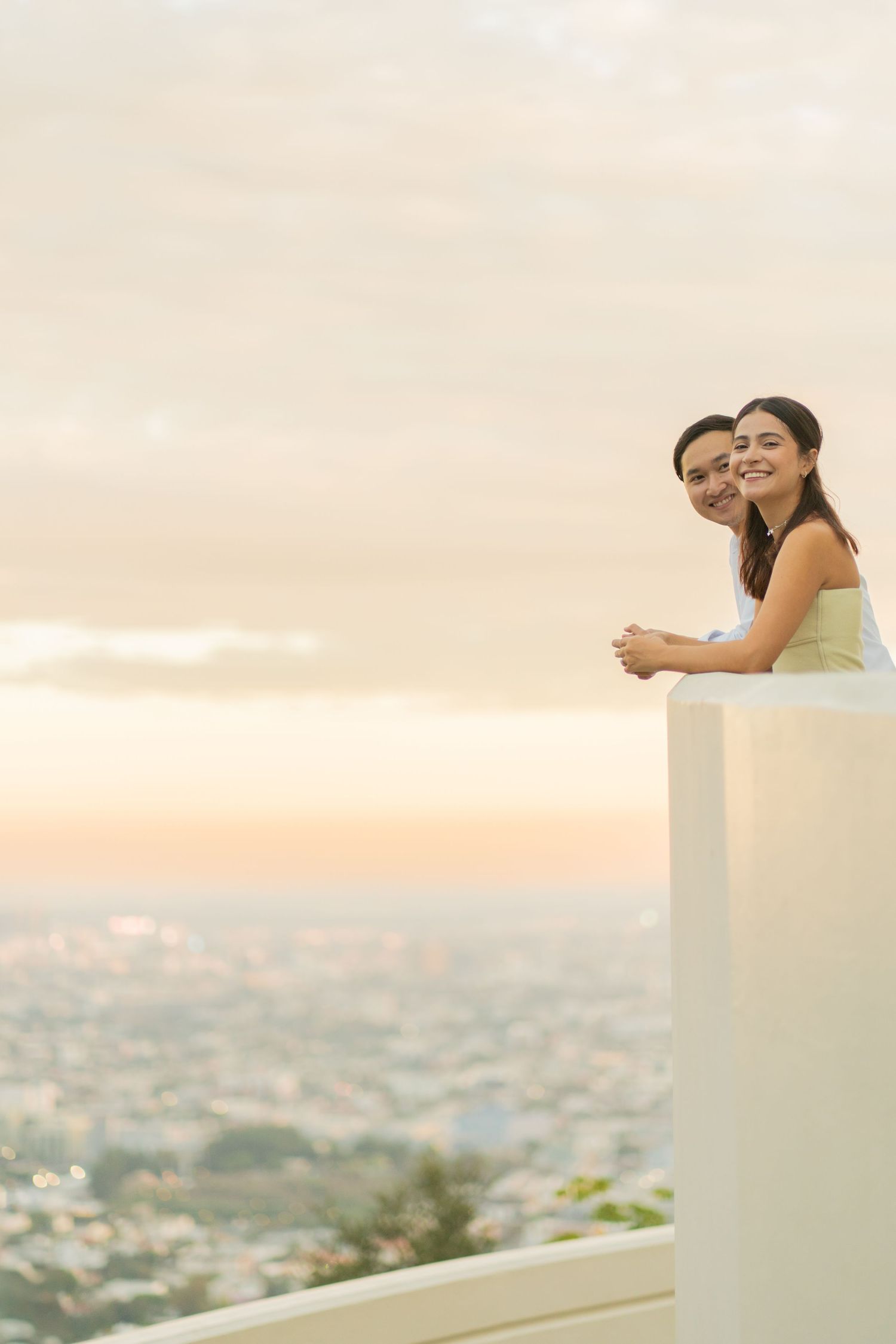 Two couples celebrating their engagements while enjoying a stunning view of Los Angeles.