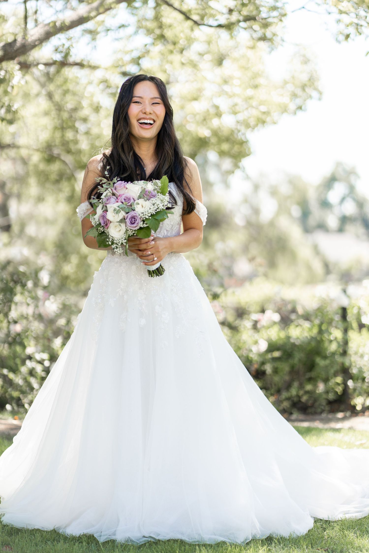 Bride glowing in a stunning solo shot, looking radiant under the sunshine.