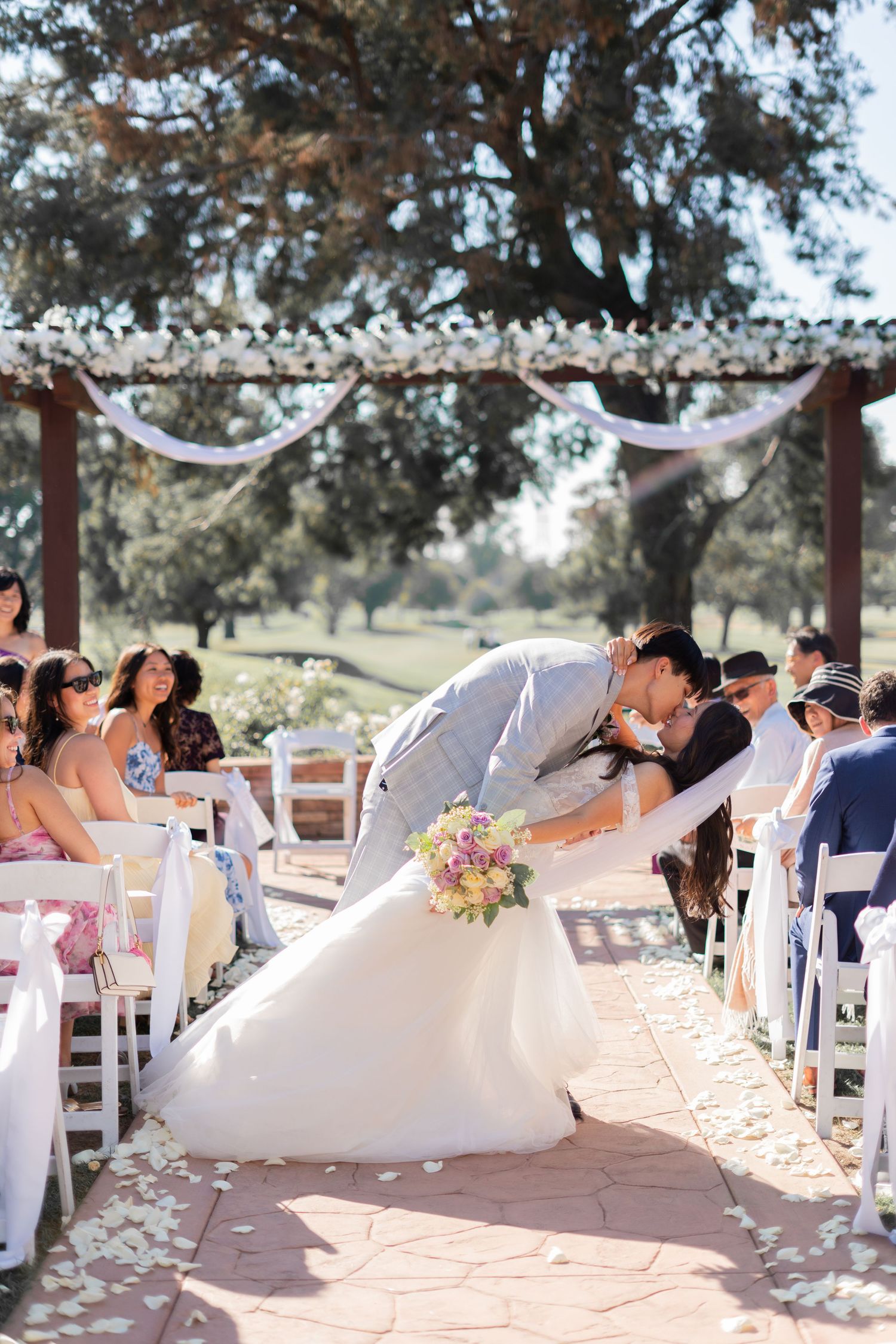 Couple sharing a kiss before exiting the wedding ceremony