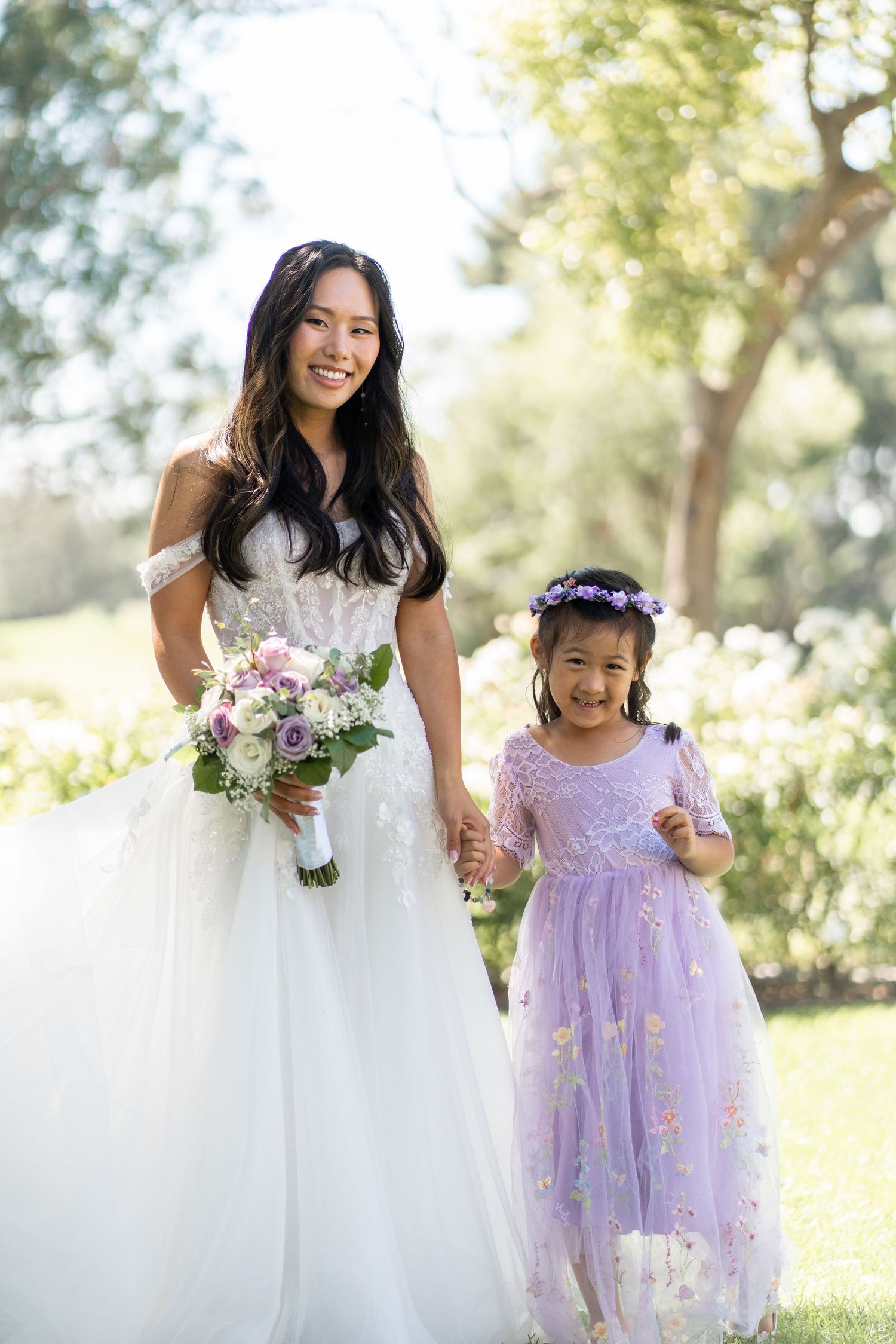 Bride and groom capturing cherished family photos surrounded by their loving relatives.