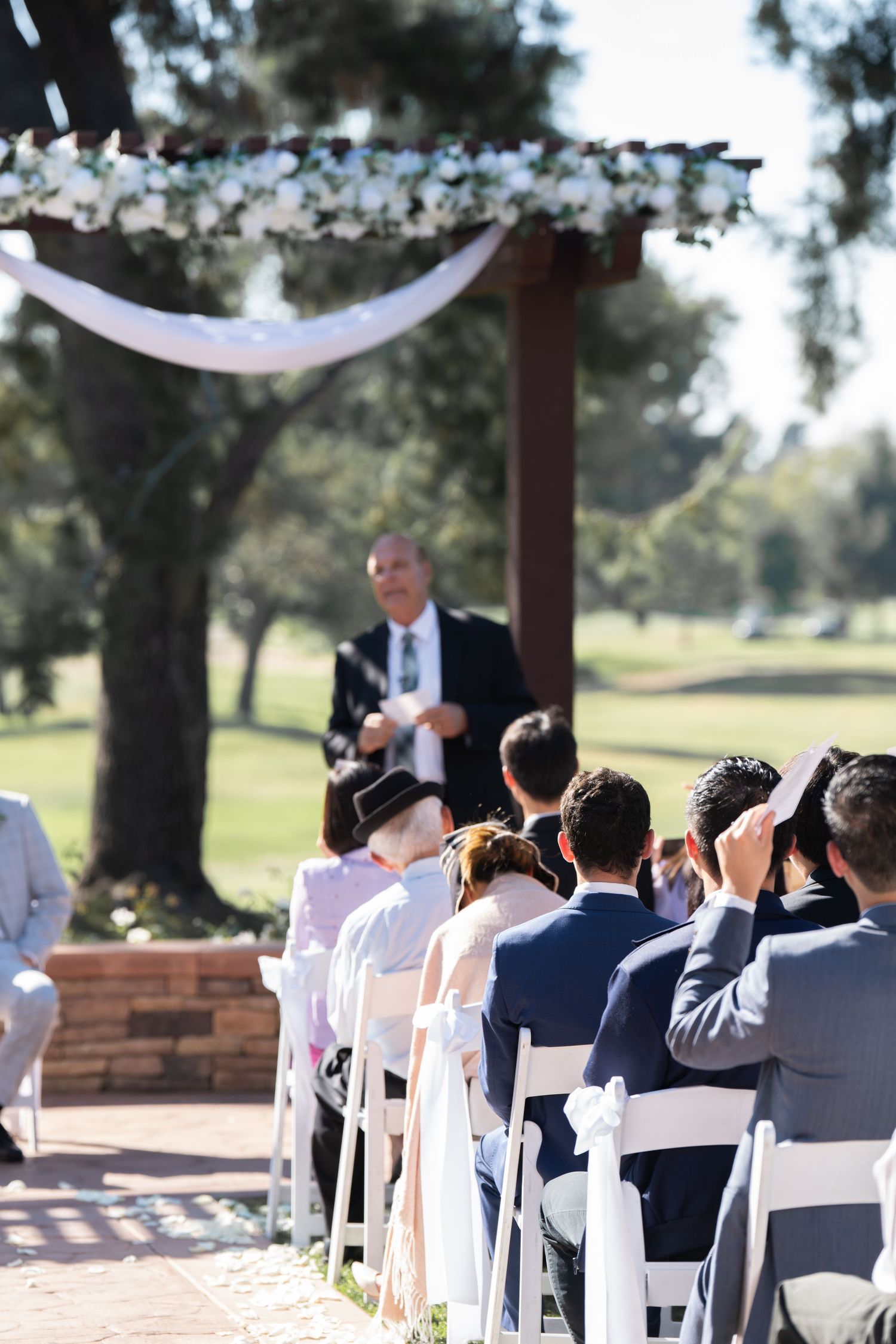 Wedding ceremony continues, filled with love and heartfelt blessings from the guests.