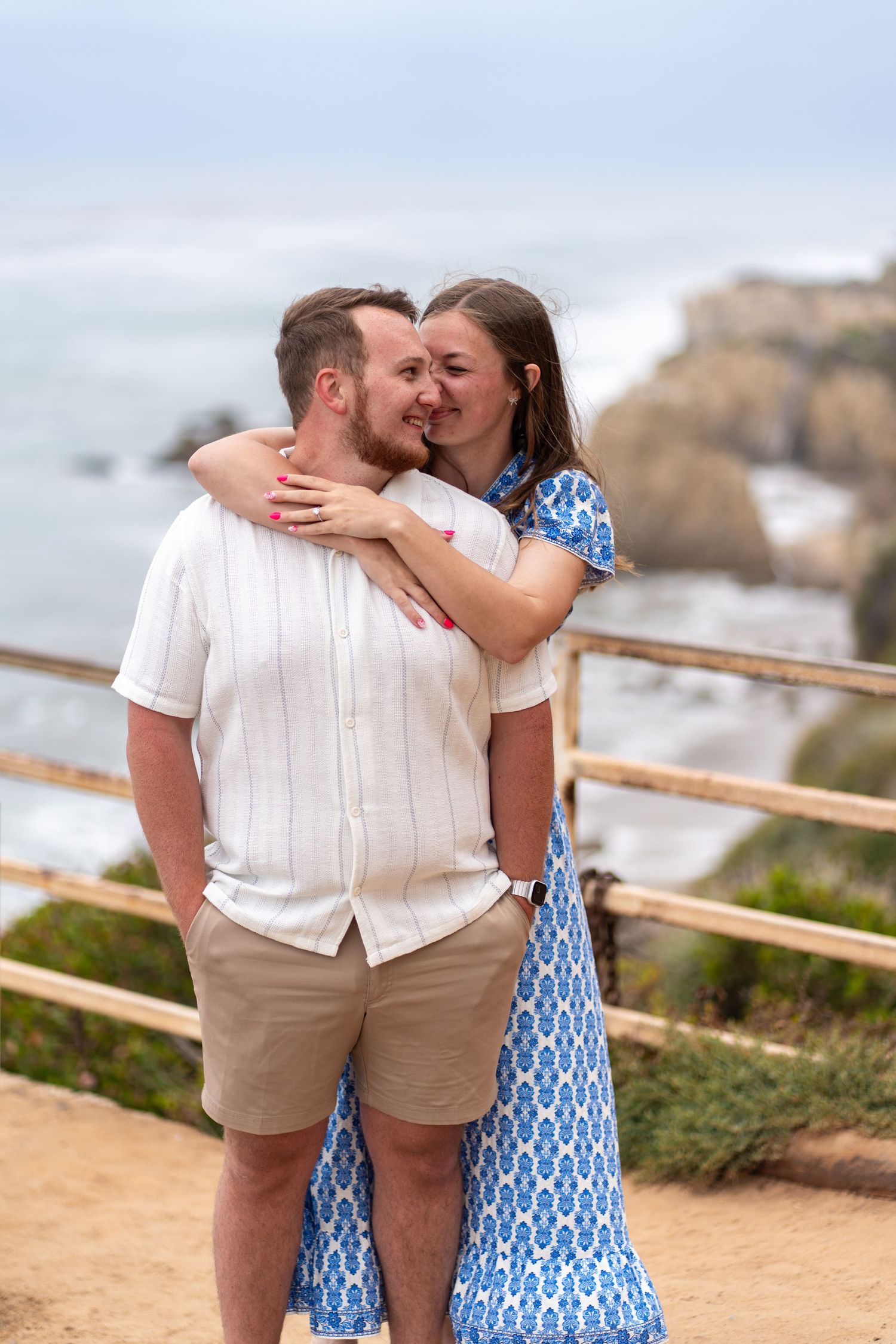 Just engaged and wrapped in love—hugging tight with El Matador sunset as their witness. #EngagementHug #JustSaidYes