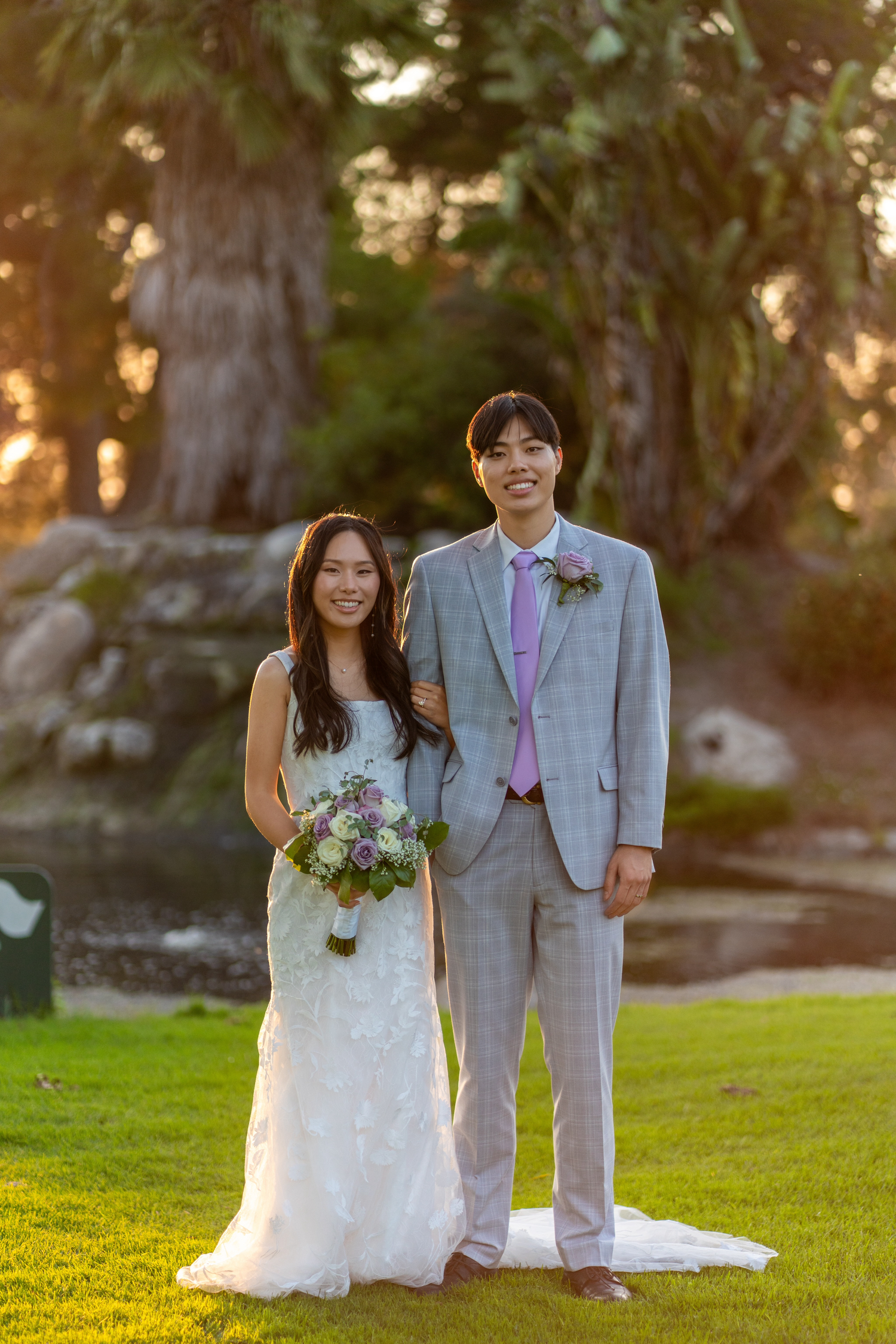 Bride and groom sharing a romantic couples photoshoot under a golden sunset.