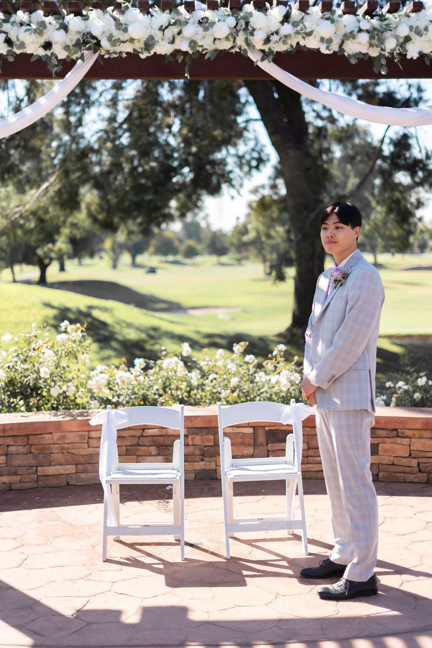 Groom patiently awaits his bride’s entrance, full of anticipation and love.
