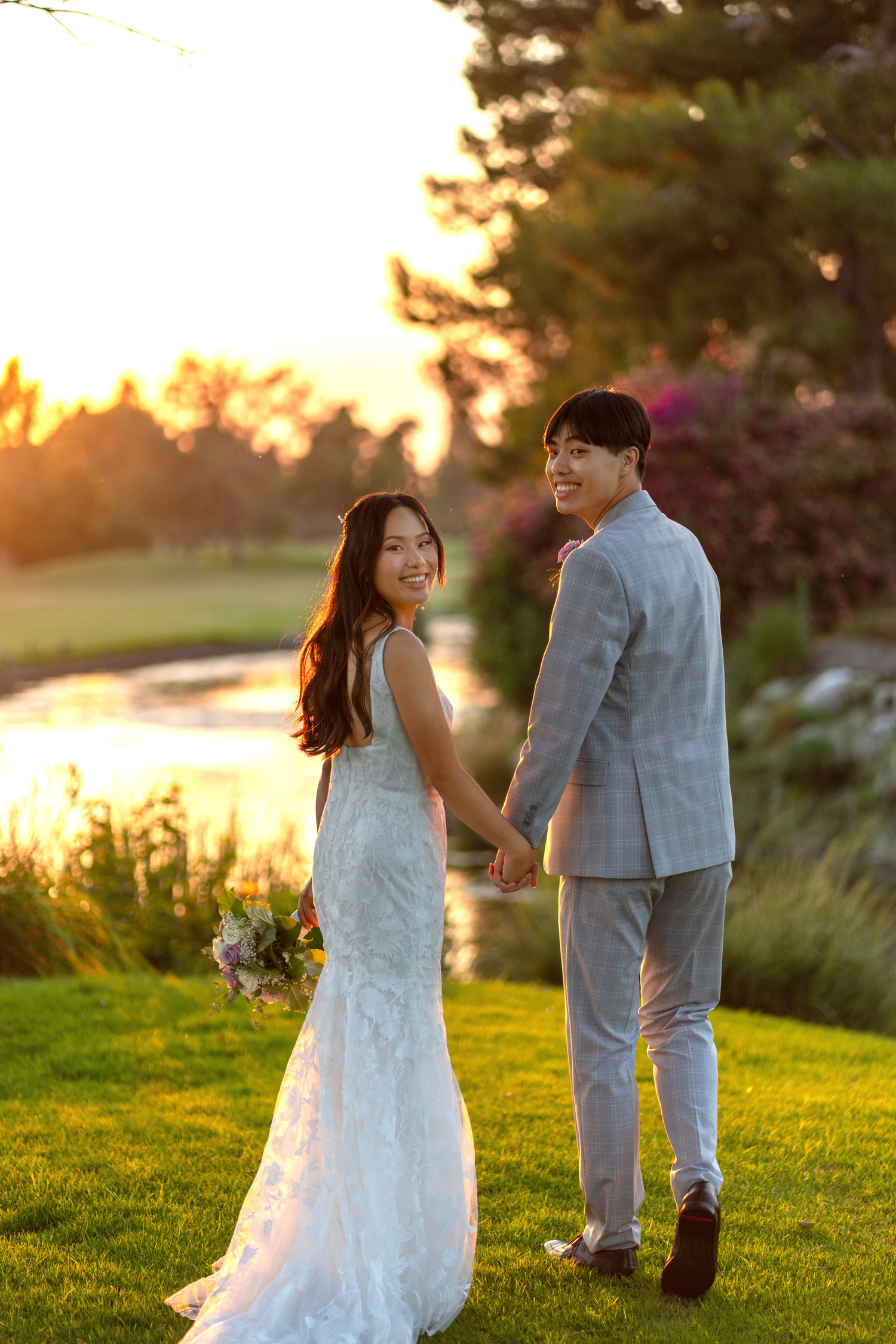 Bride and groom sharing a romantic couples photoshoot under a golden sunset.