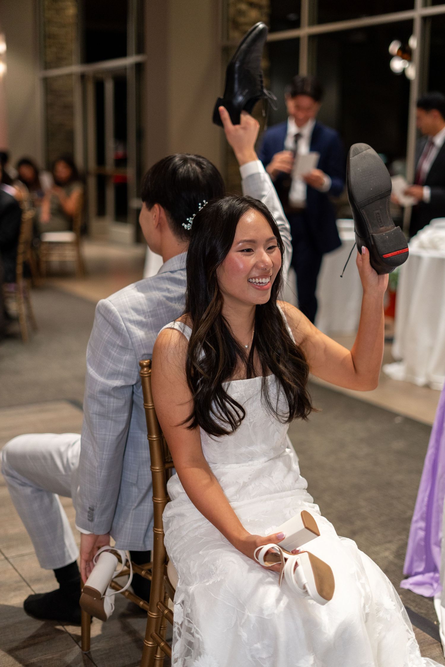 Bride and groom having fun with a game, seeing who knows each other best.