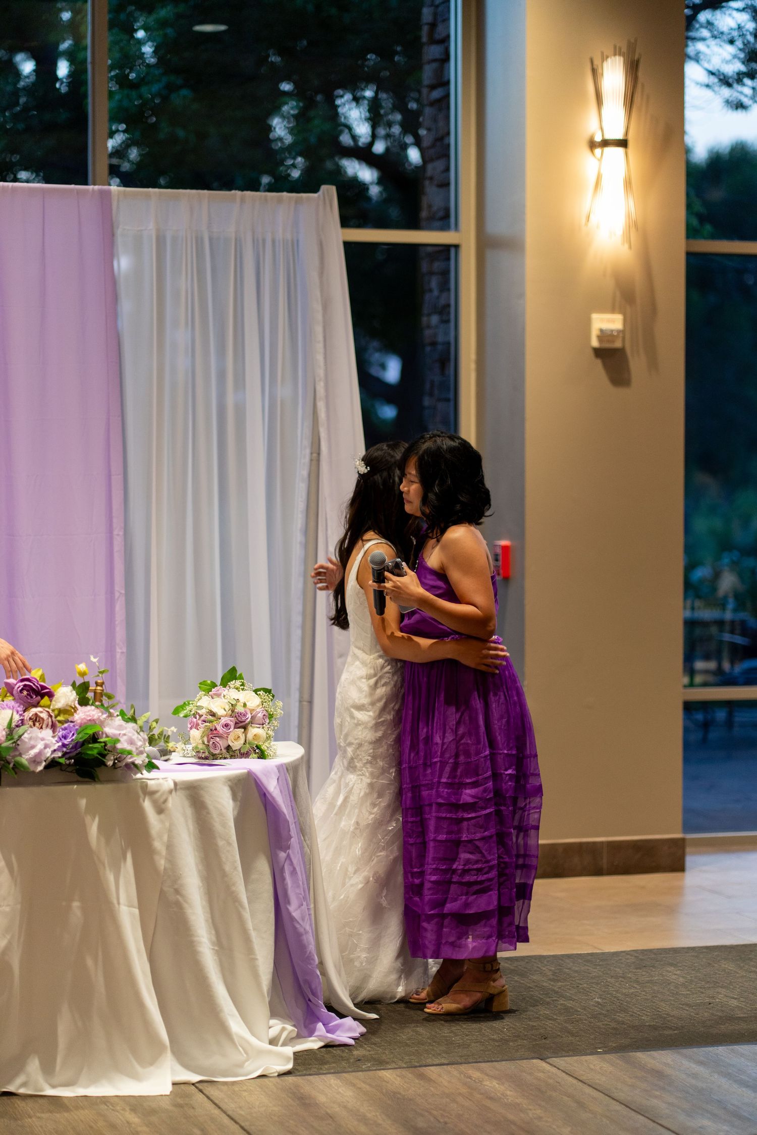 Guests share heartfelt words for the bride and groom, offering love and blessings.