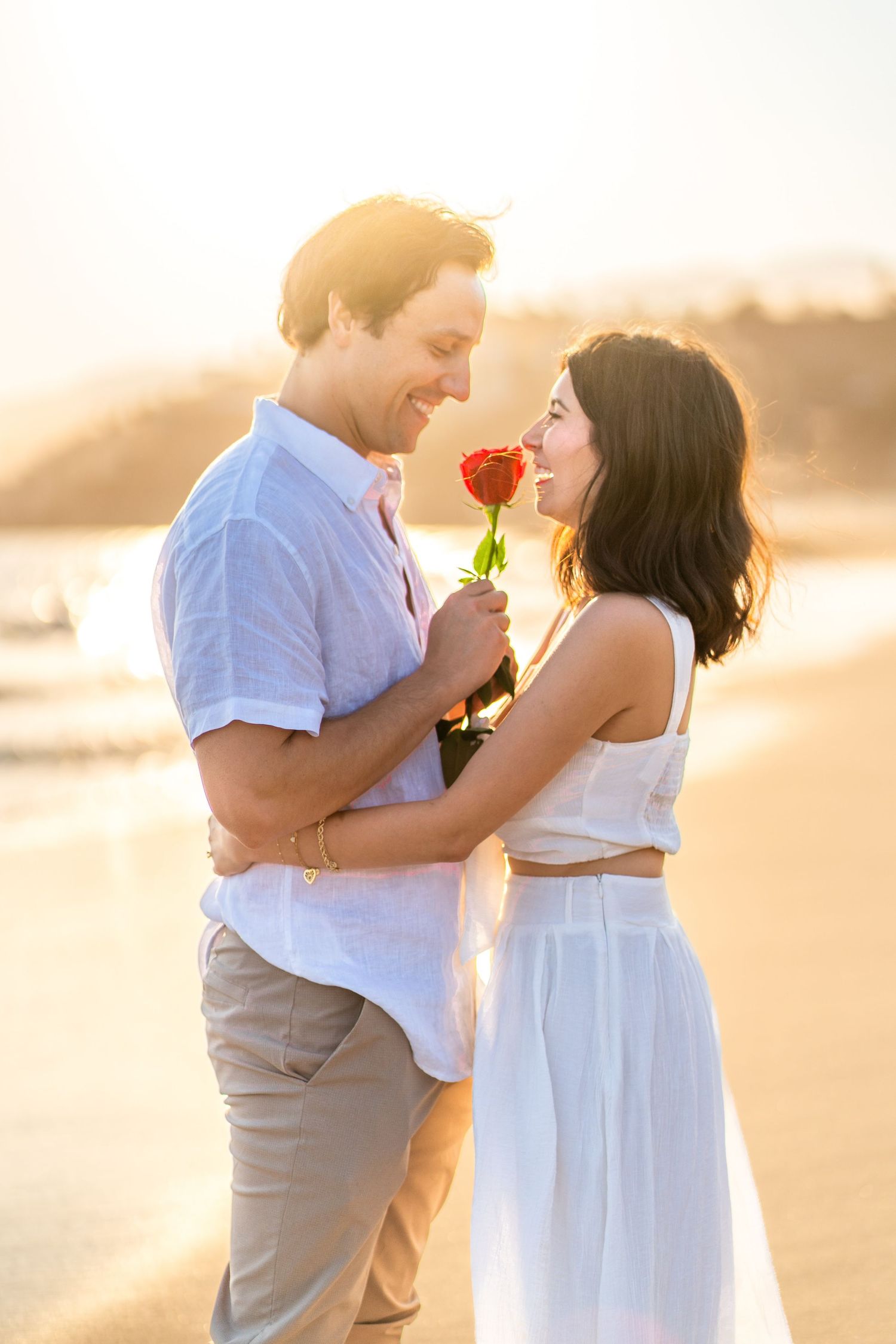 Two couples sharing love and sweet moments by the beautiful Santa Monica Beach.