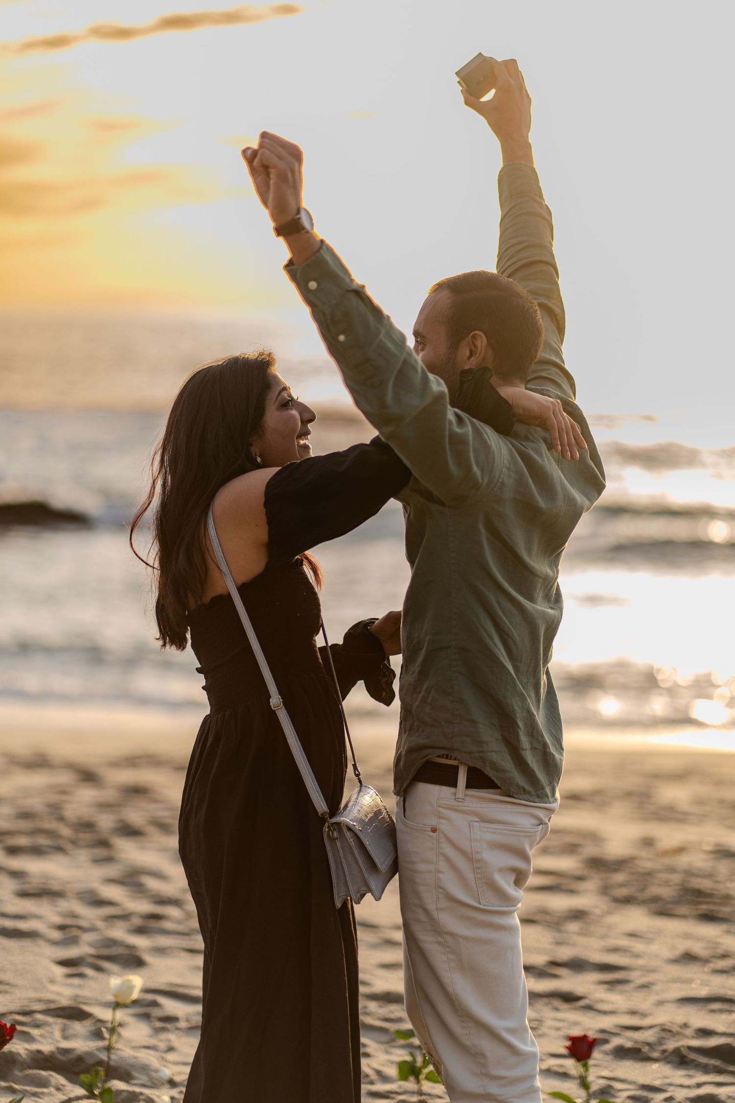 Newly engaged couple celebrating love with a stunning Laguna Beach backdrop, ocean views, and dreamy Southern California coastal scenery.