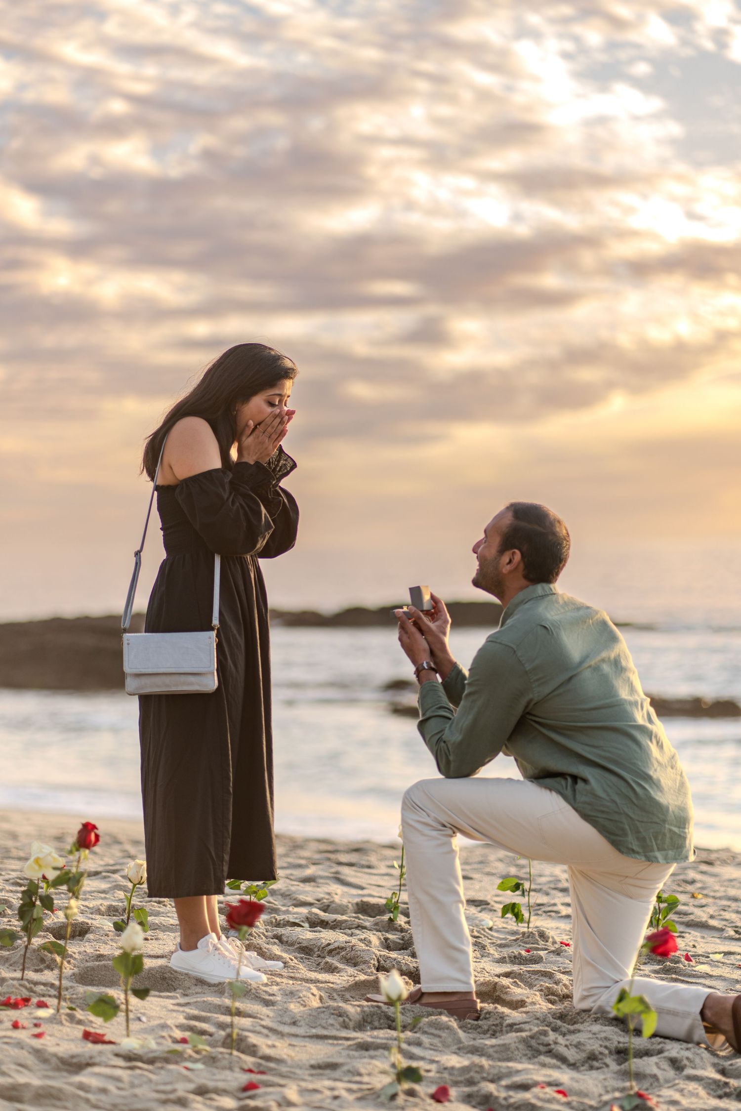 Newly engaged couple celebrating love with a stunning Laguna Beach backdrop, ocean views, and dreamy Southern California coastal scenery.