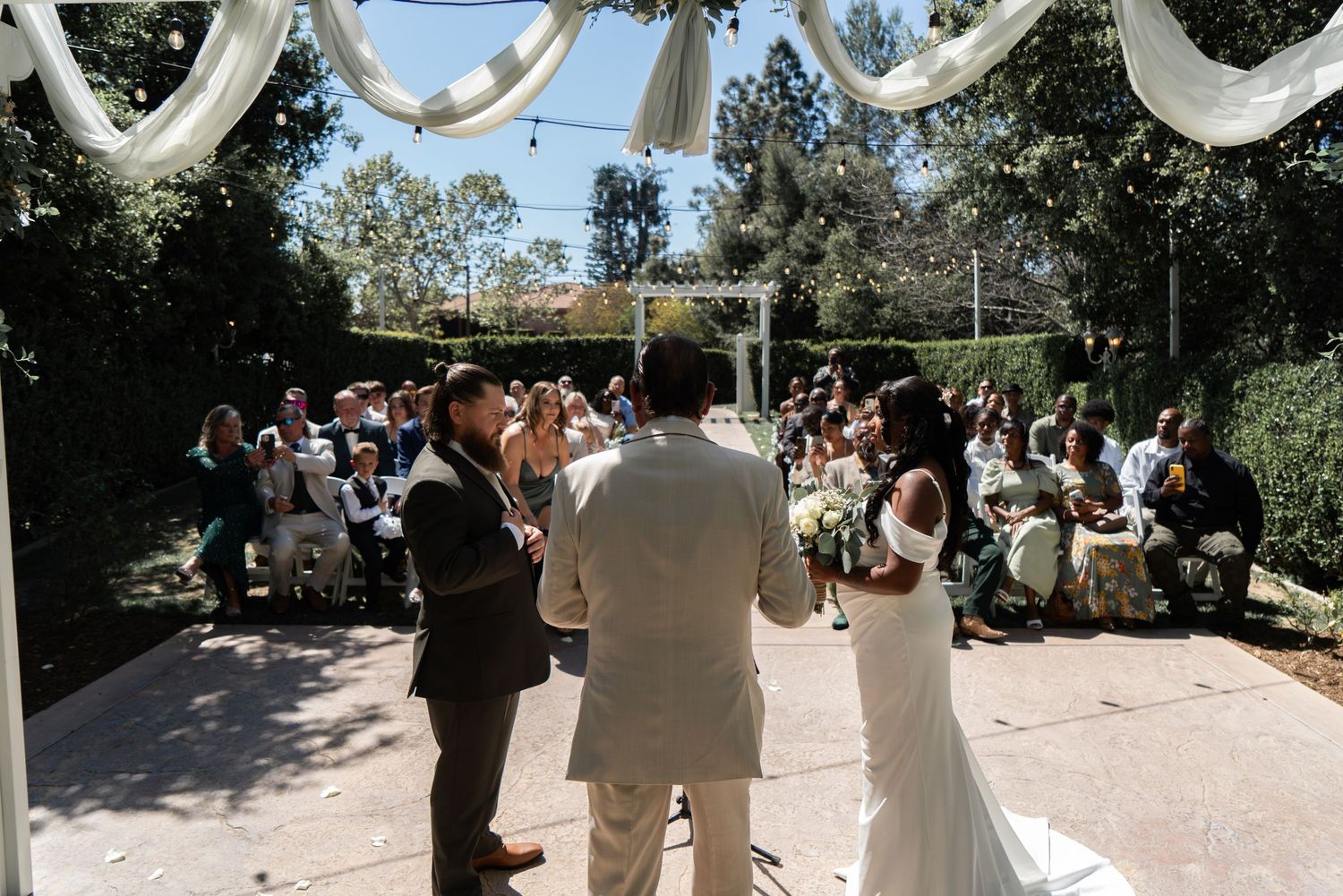 Saying “I do” and beginning forever—bride and groom tie the knot in a moment full of love. #WeddingCeremony #ForeverStartsNow