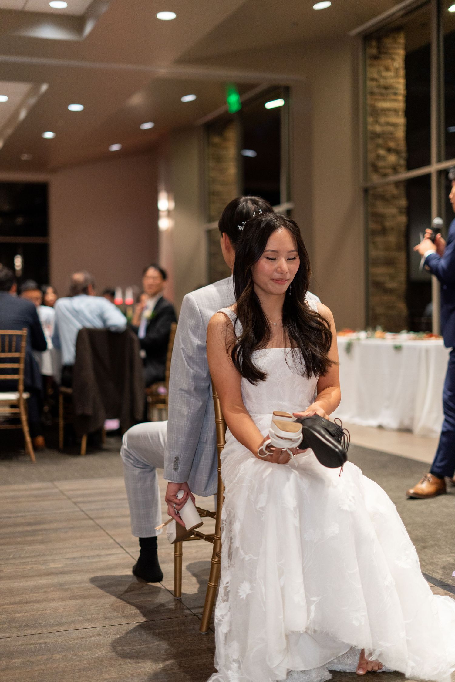 Bride and groom having fun with a game, seeing who knows each other best.
