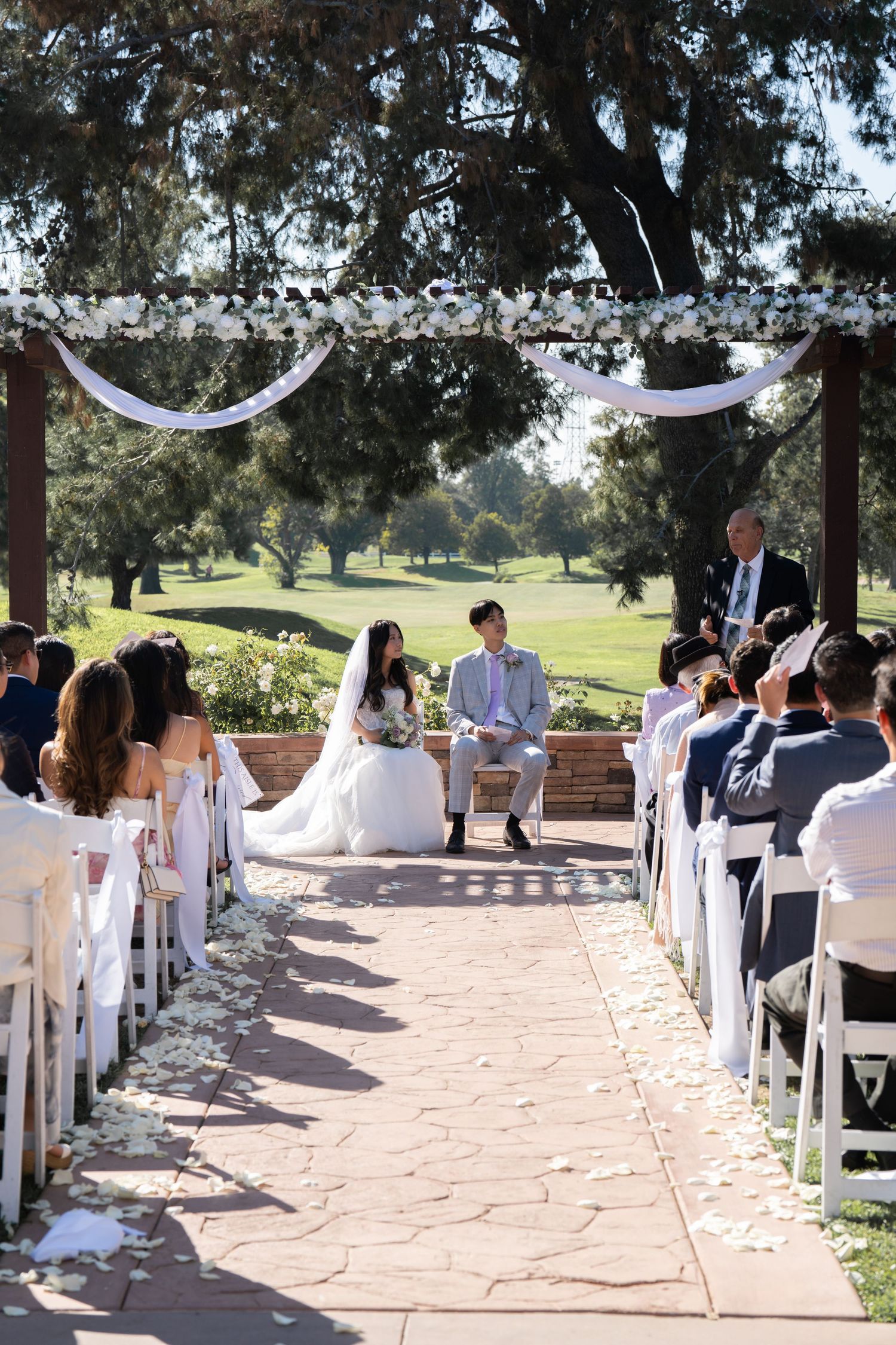 Wedding ceremony continues, filled with love and heartfelt blessings from the guests.