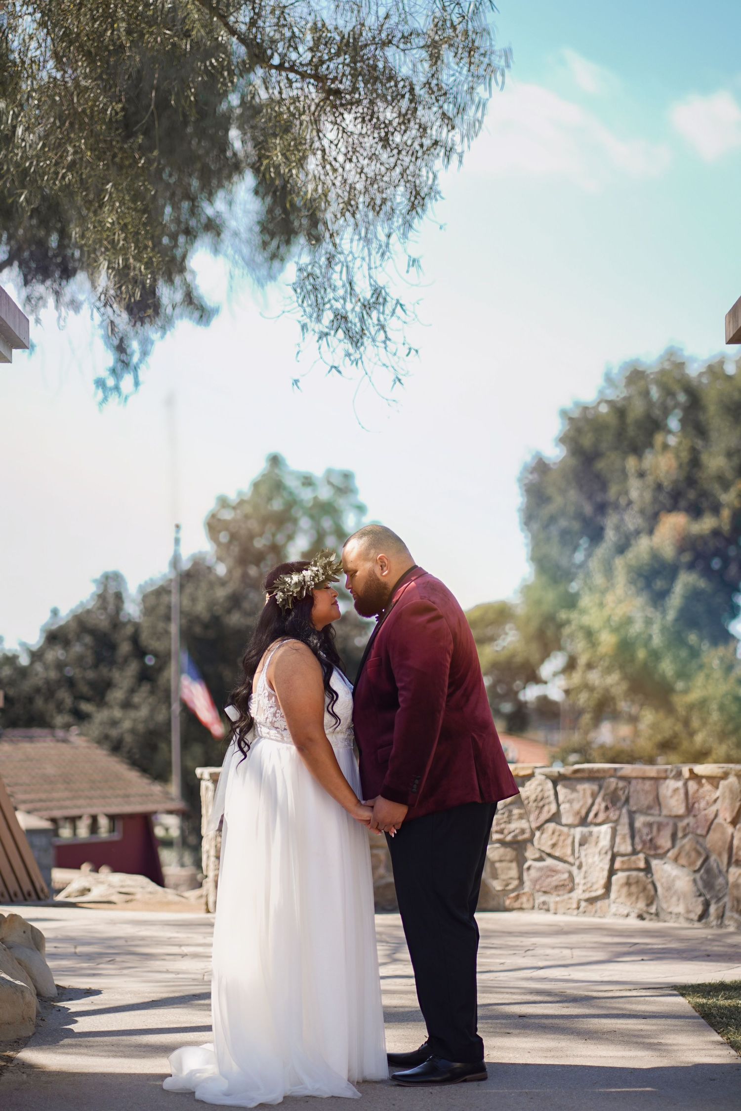 Bride and groom sharing romantic kisses in the park—capturing pure love and joy in nature’s embrace. #WeddingKiss #RomanticMoments #ParkWedd