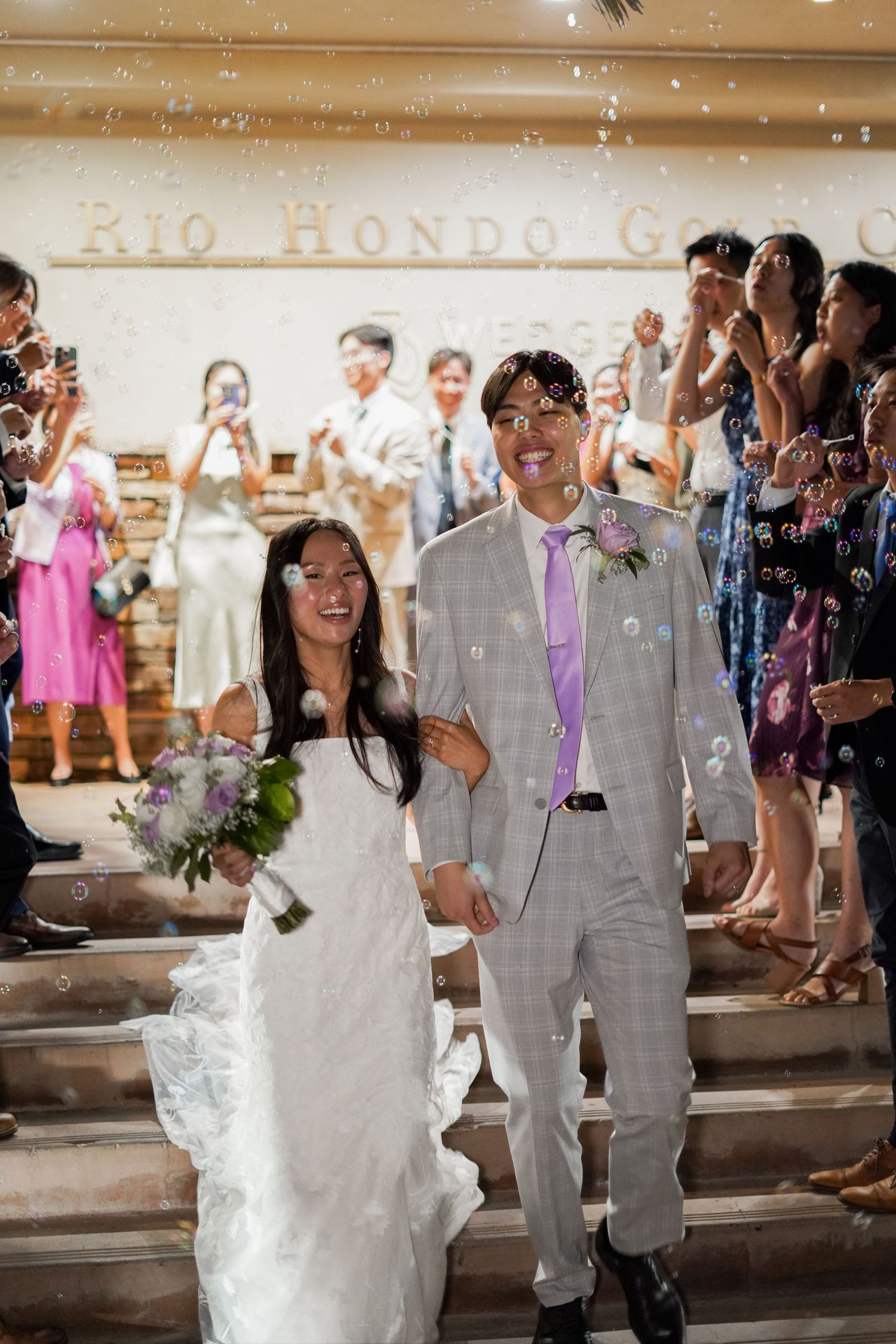 Bride and groom’s grand exit surrounded by love, joy, and blessings from their guests.
