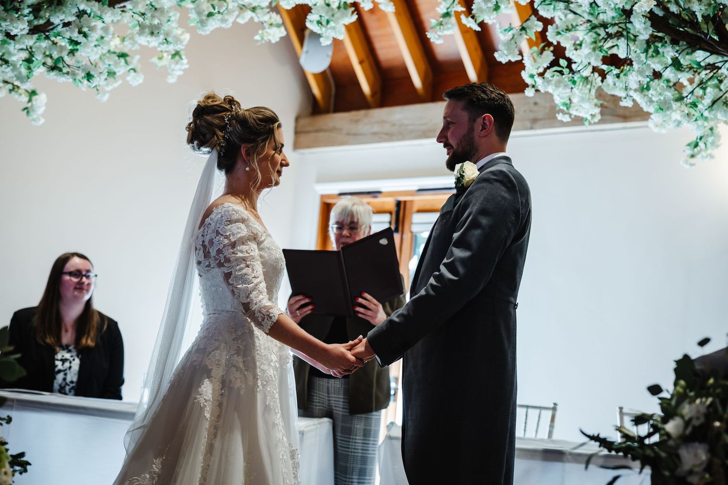 A romantic first dance between newlyweds at their intimate indoor wedding reception.