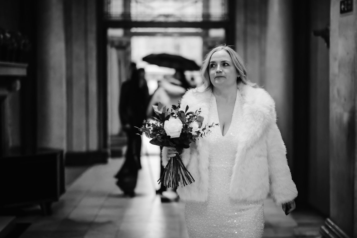 A black and white wedding photo collage showing intimate moments between a bride and groom in various indoor settings.