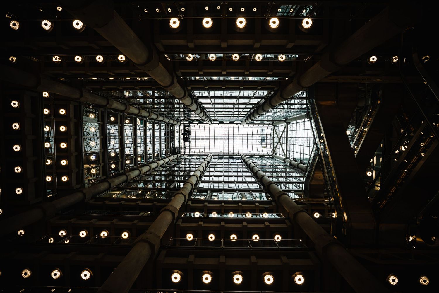 An abstract architectural view of illuminated ceiling patterns.