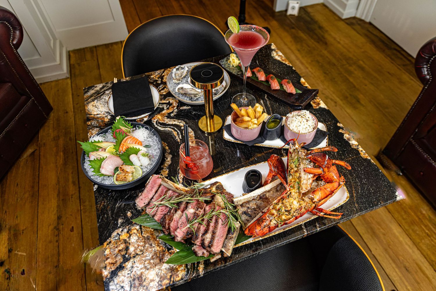 A collection of sushi rolls and sashimi arranged on wooden plates showcases fresh seafood and traditional Japanese cuisine.