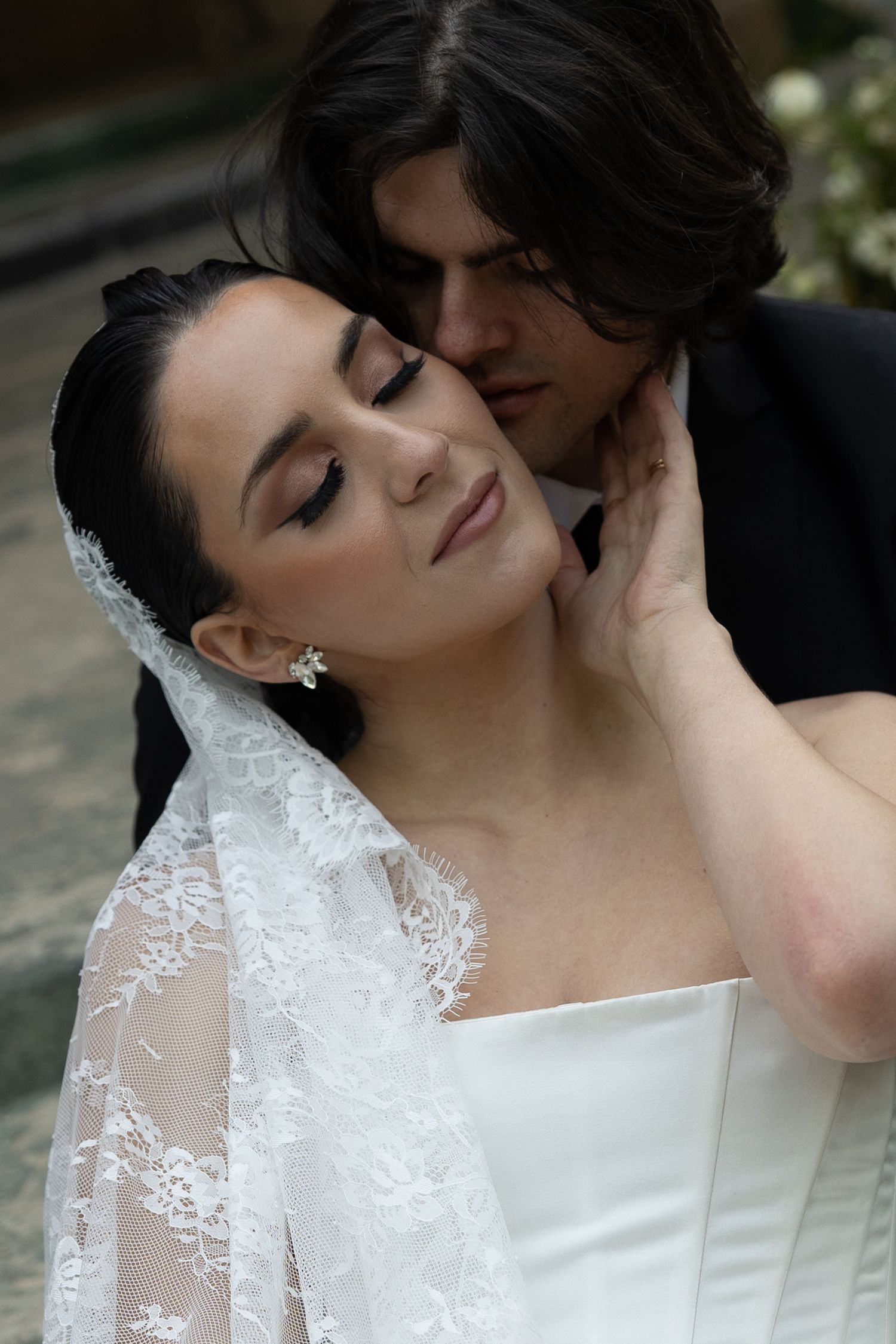 A romantic wedding portrait sequence shows tender moments between a bride in a lace gown and her partner.