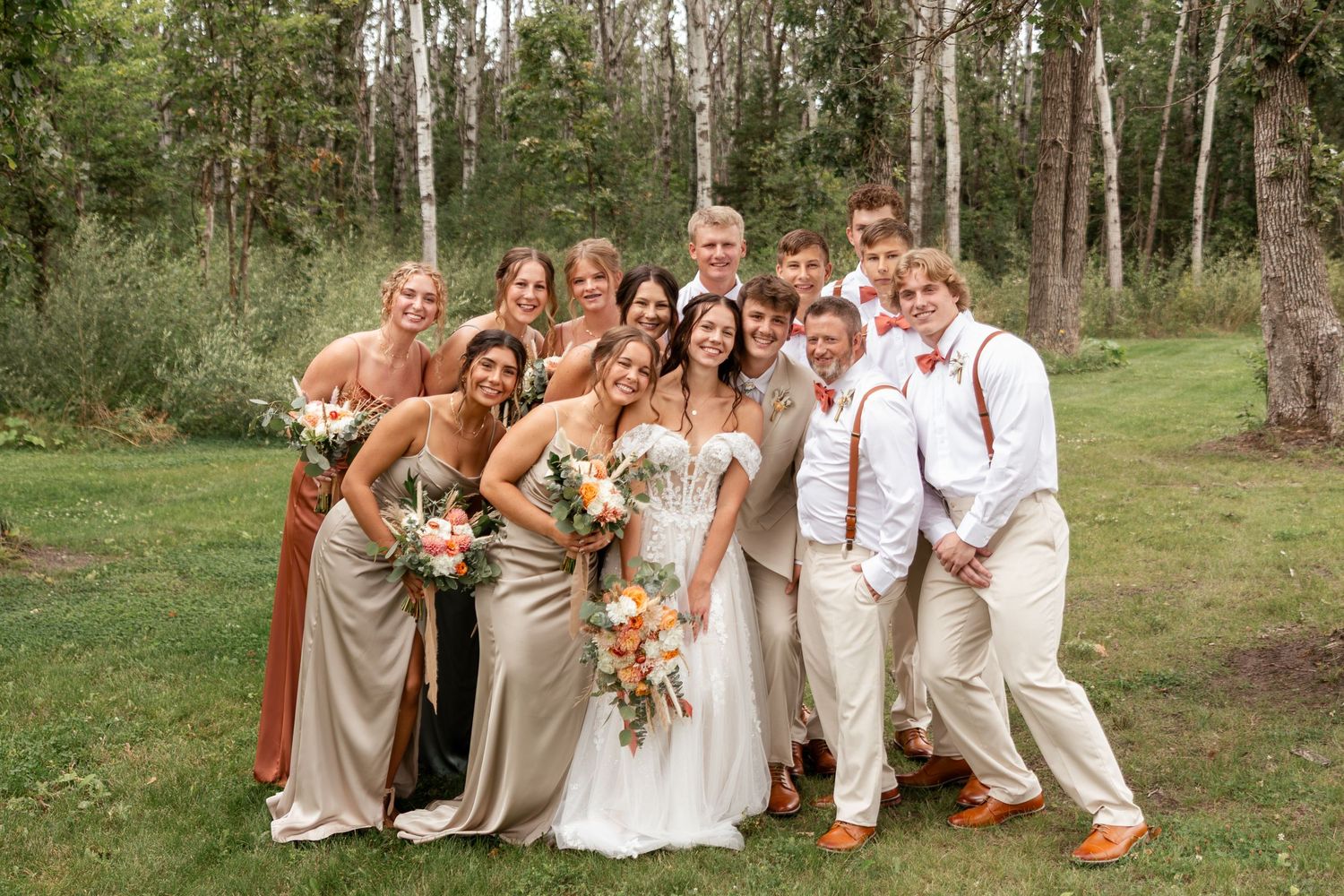 Wedding party poses together in a series of outdoor photos featuring neutral tones and natural woodland settings.