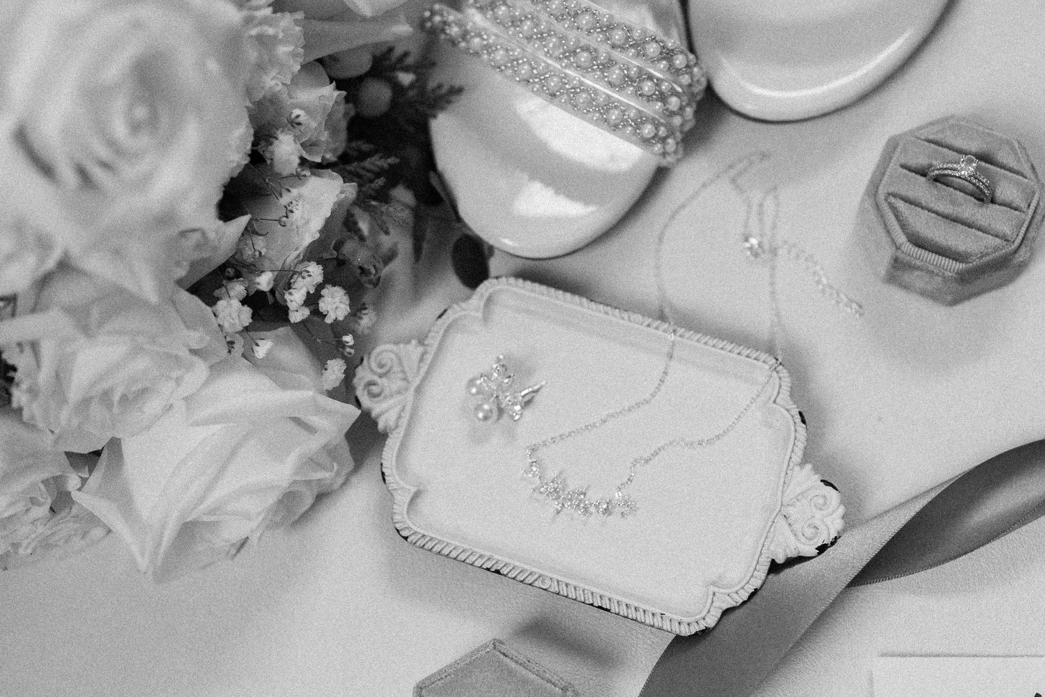 Wedding decorations with white flowers, silver frames, and elegant table settings create a romantic atmosphere.