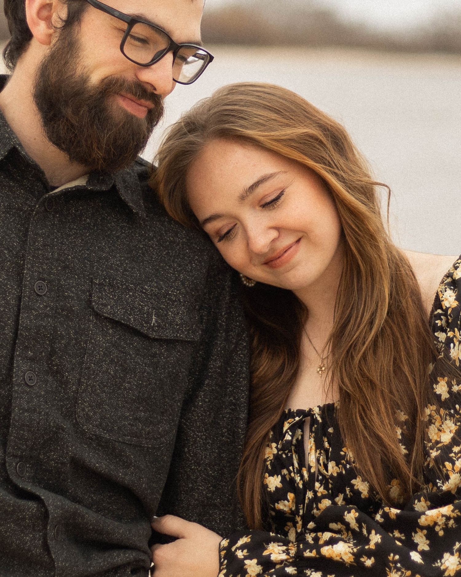 An intimate indoor portrait session with soft lighting and warm tones.