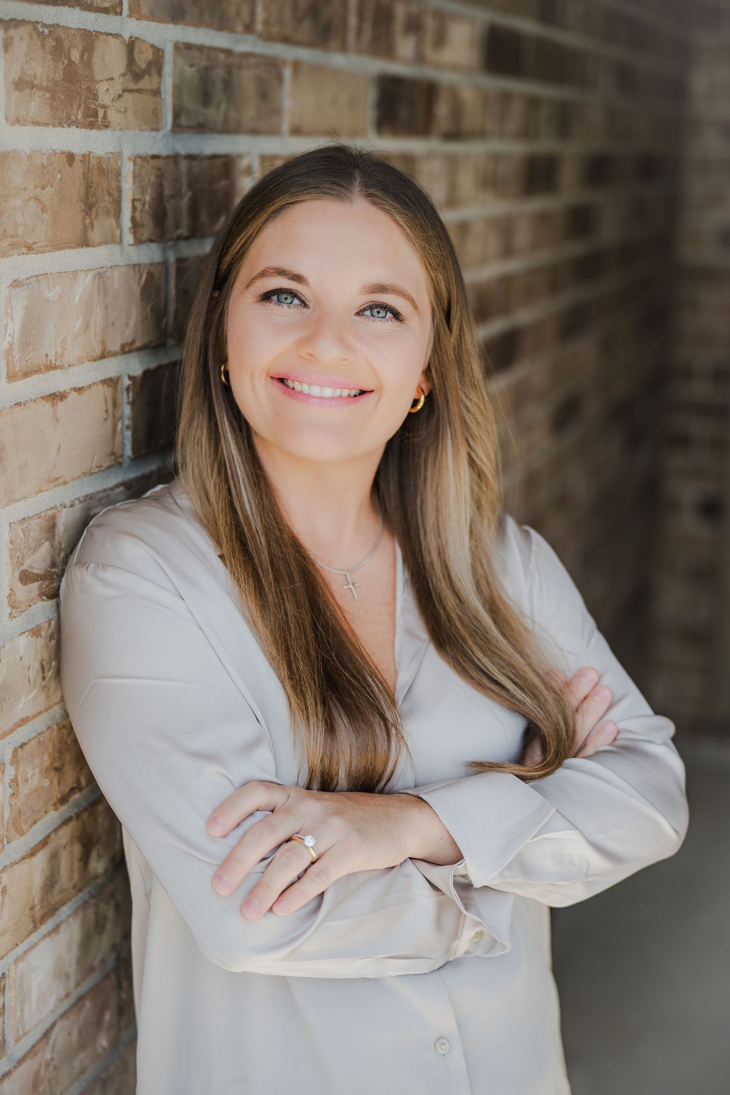 Portrait series against brick wall showing expressions and poses.