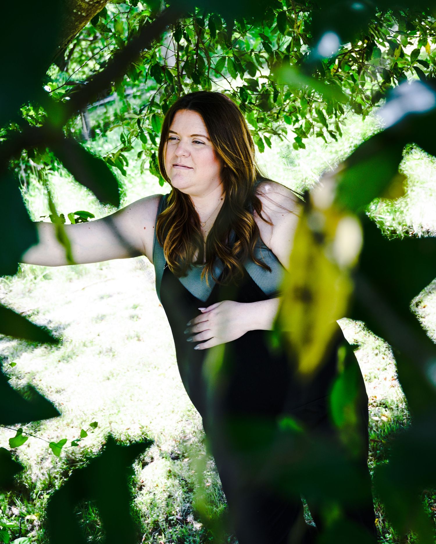 Artistic outdoor photography series with dappled sunlight through green leaves.