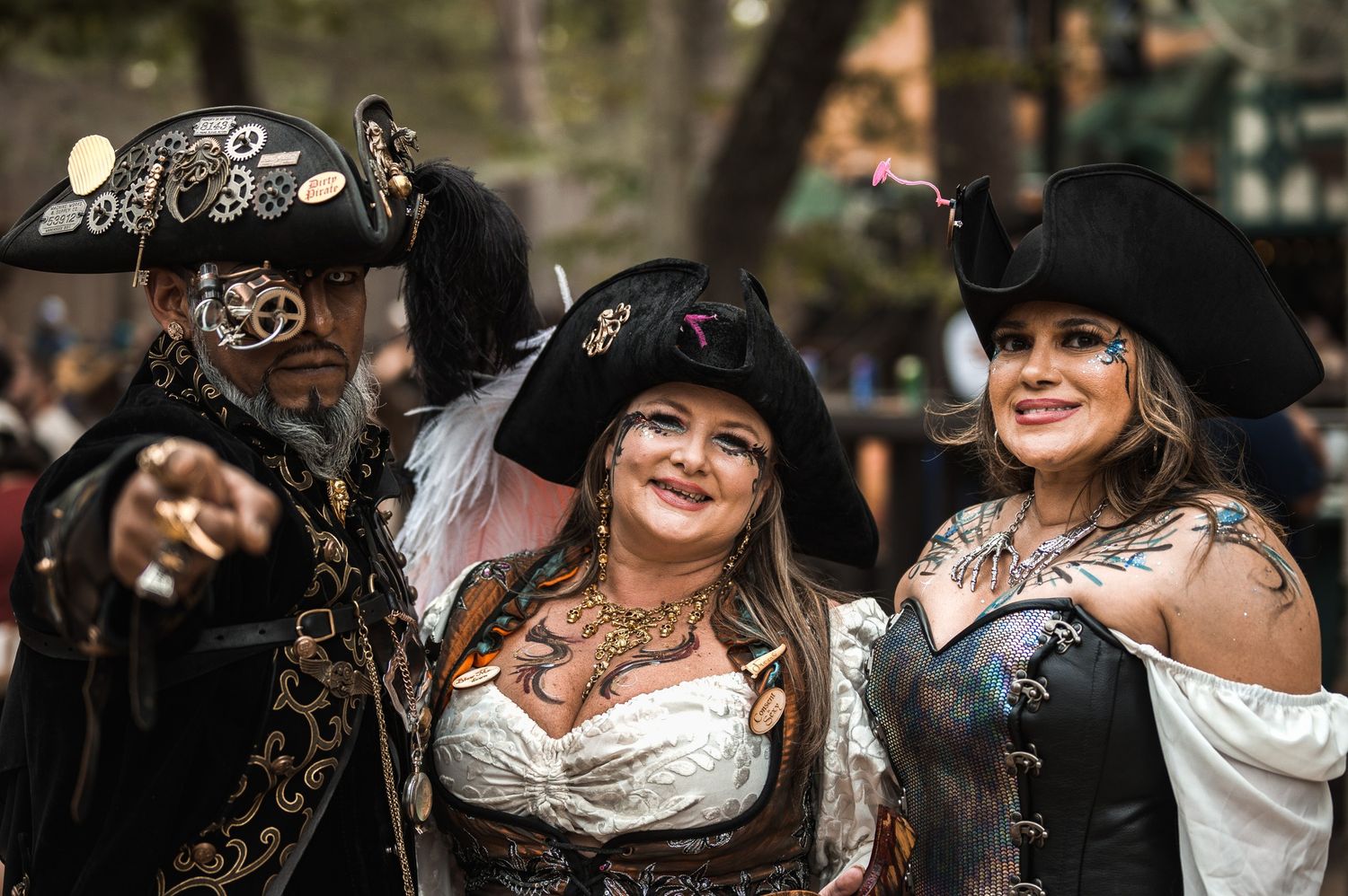 Group wearing vintage-style hats and costumes at outdoor gathering.