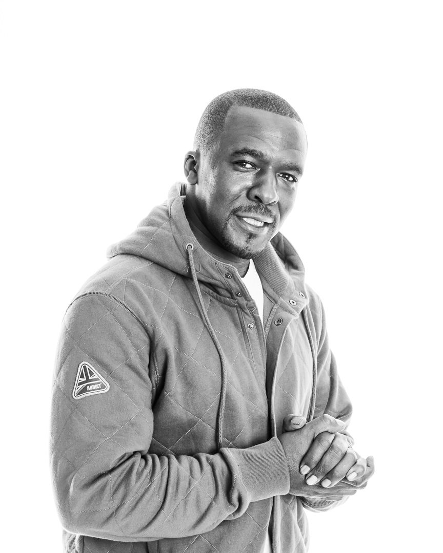 Series of black and white portraits showing animated expressions in gray clothing.