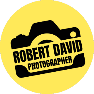 Black camera silhouette logo design with text 'Robert David Photographer' on bright yellow circular background.