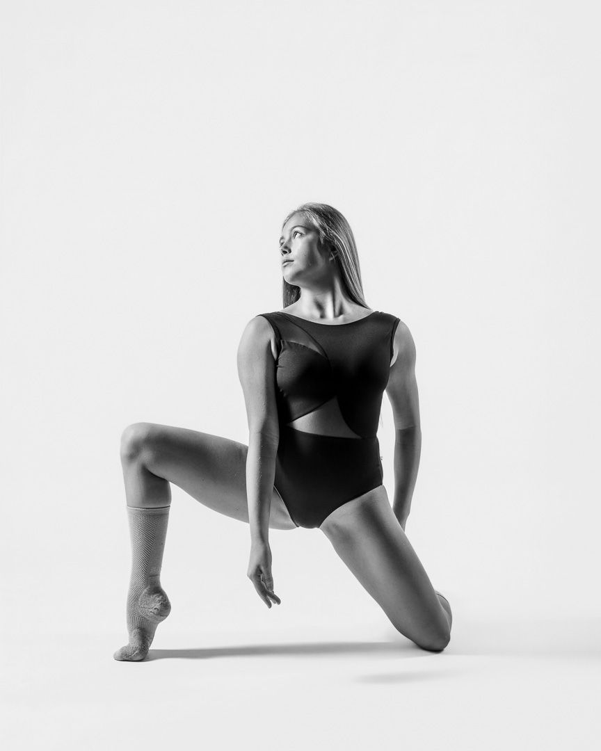 Artistic black and white dance photography series showing graceful poses and movements in minimalist style.