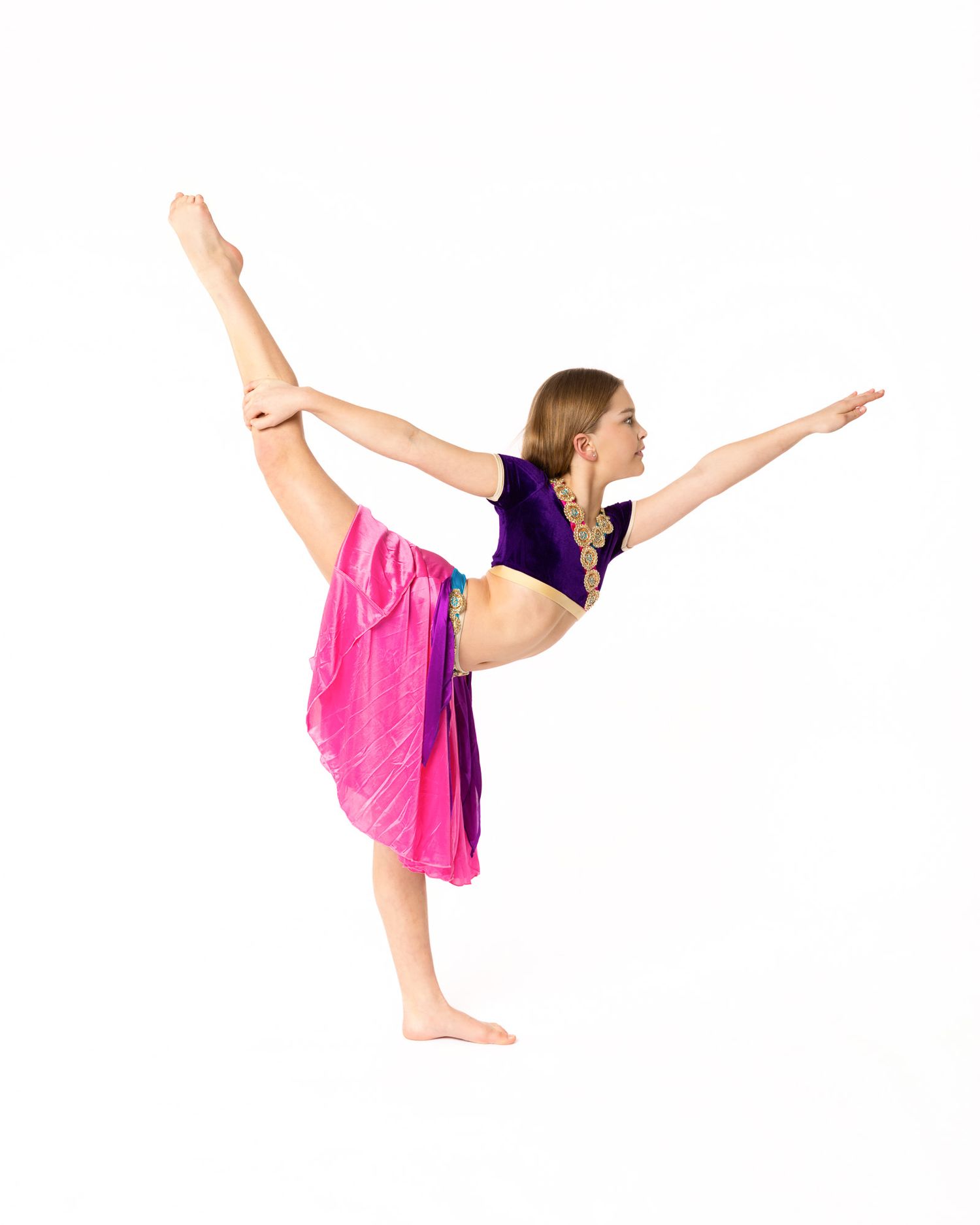 Sequence of four dance poses showing a gymnast performing a graceful standing split with pink flowing costume.