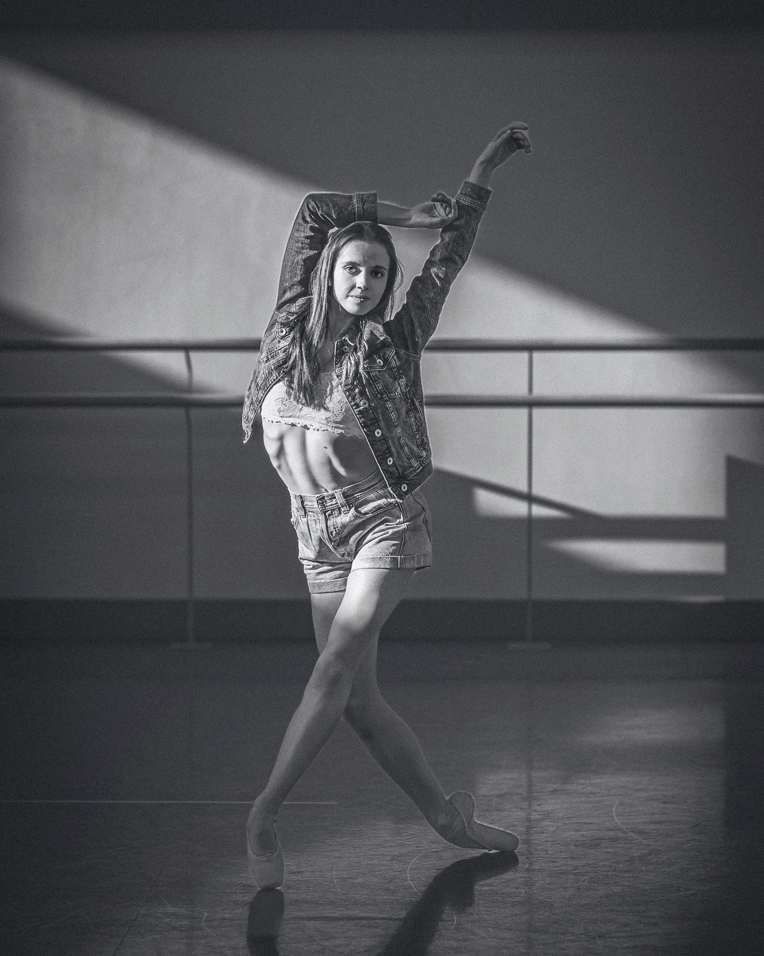 A dancer in motion performs an expressive contemporary dance sequence shown in black and white photographs.