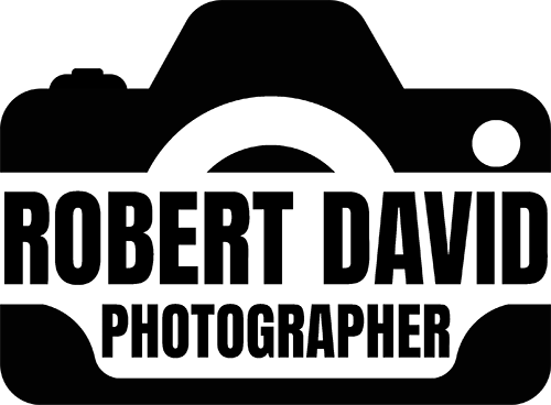 Robert David Photographer logo featuring bold black text inside a camera silhouette icon.