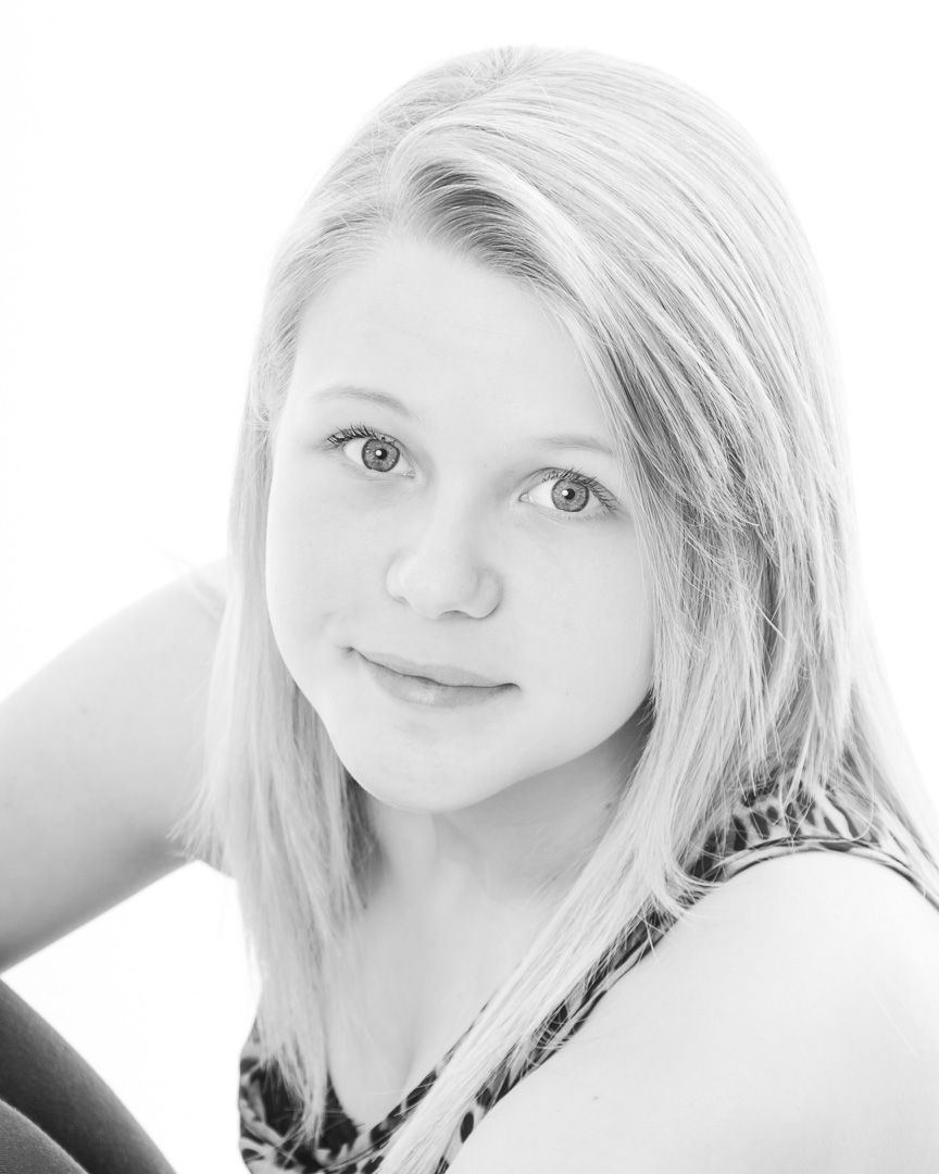 Black and white portrait series showing different expressions and angles in a light, minimalist style.
