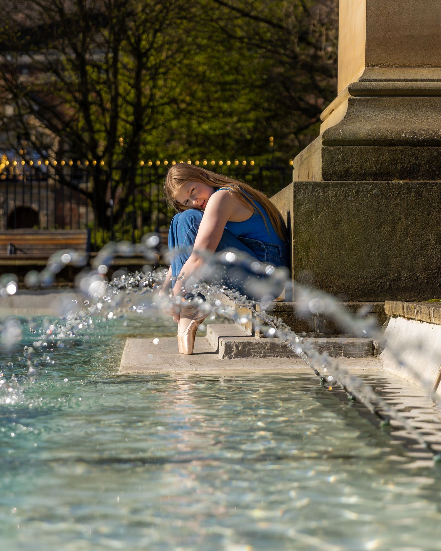 A sequence of splashing water photos showing someone diving into a fountain with dramatic water spray effects.