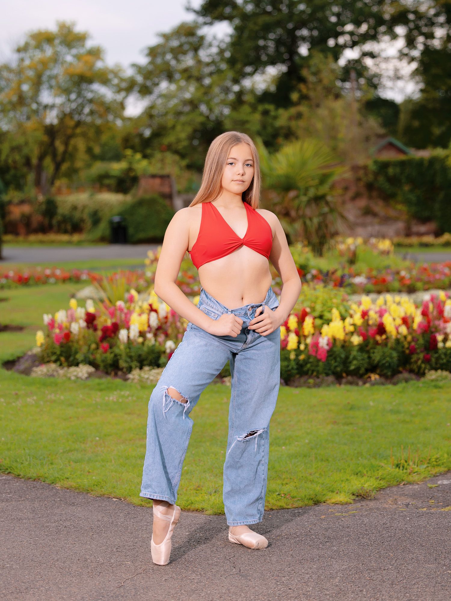 A series of dance poses in a garden with colorful flowers and green grass in the background.
