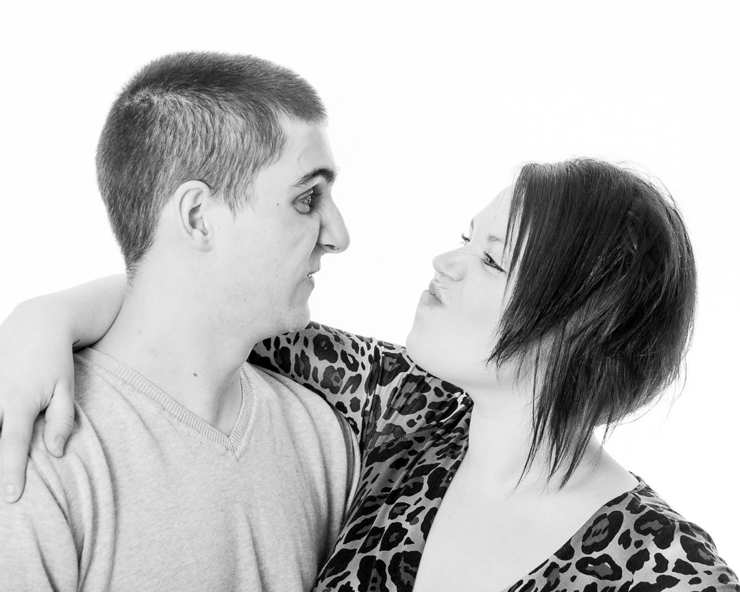 Black and white photo sequence showing a couple in an emotional dance-like interaction against white background.