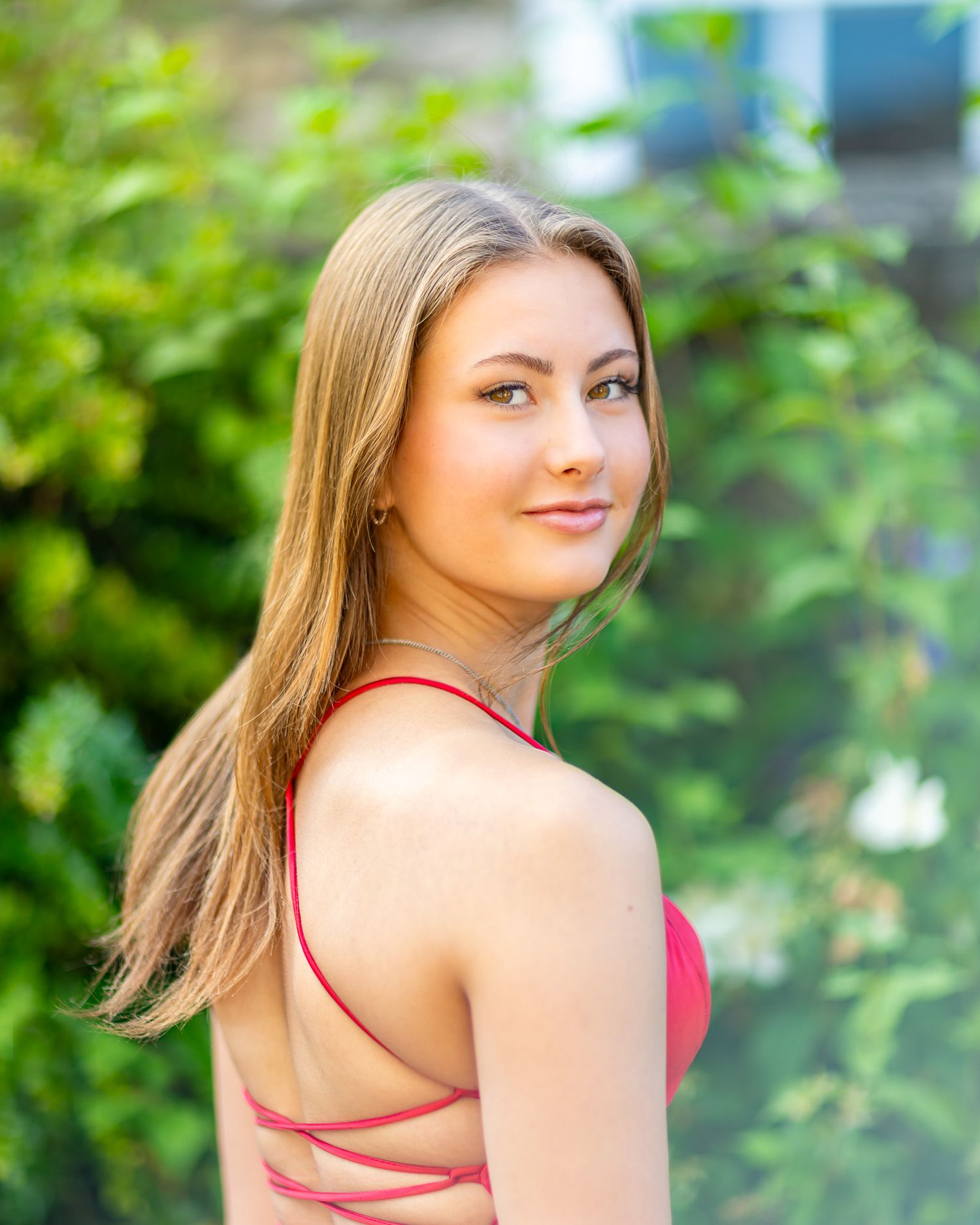Portrait style photos against lush green foliage background.