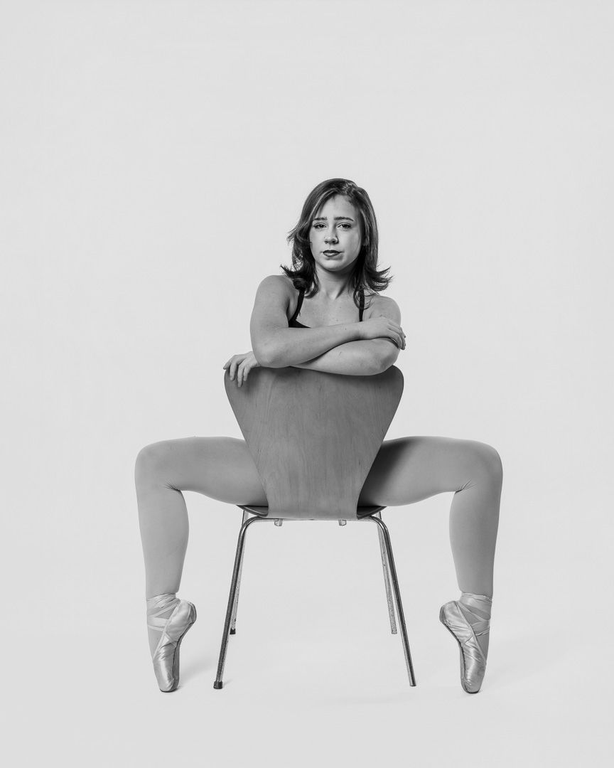 Black and white artistic dance poses captured against white background showing graceful movements and flexibility.