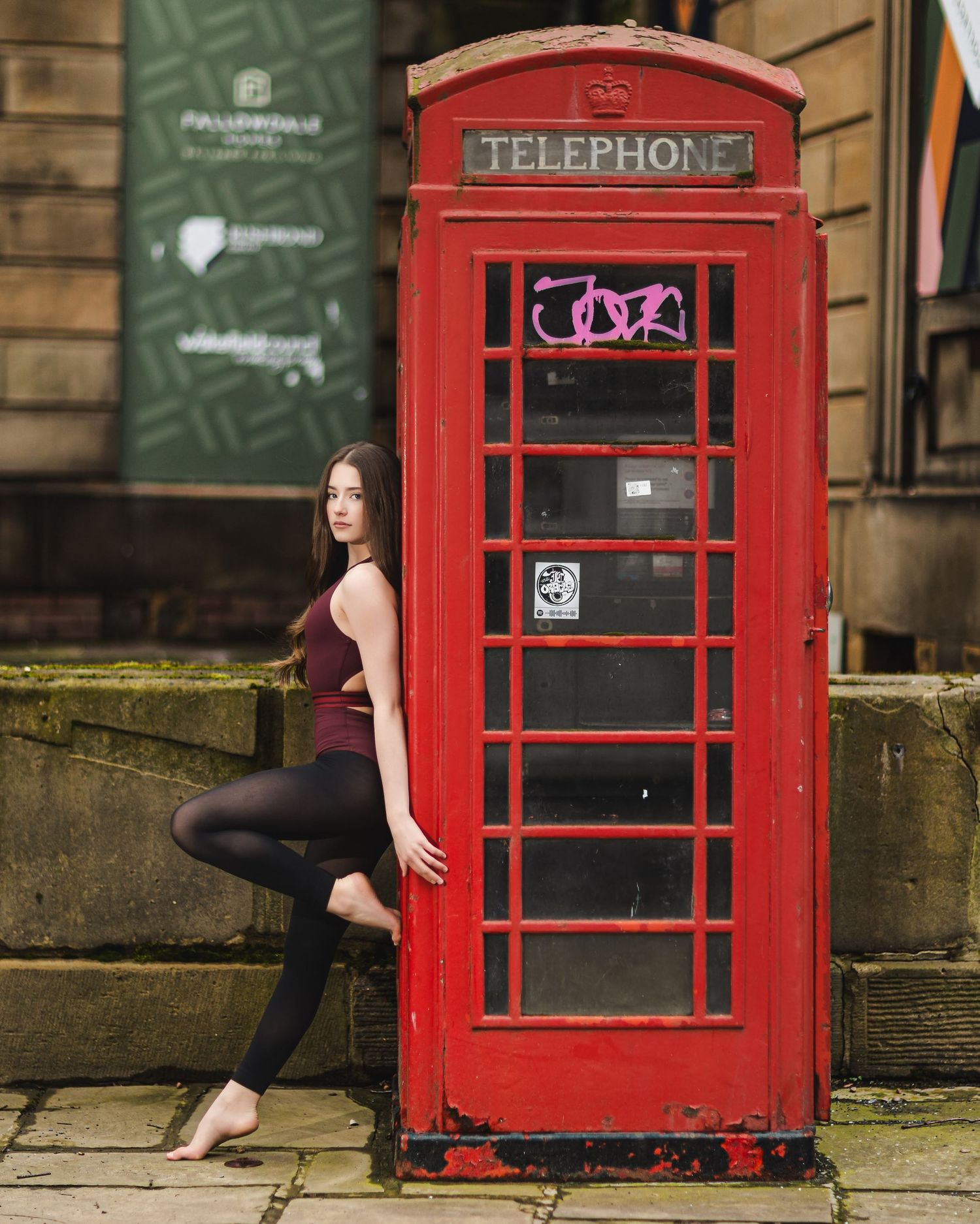 A series of photos showing a red British telephone booth against a stone building wall.